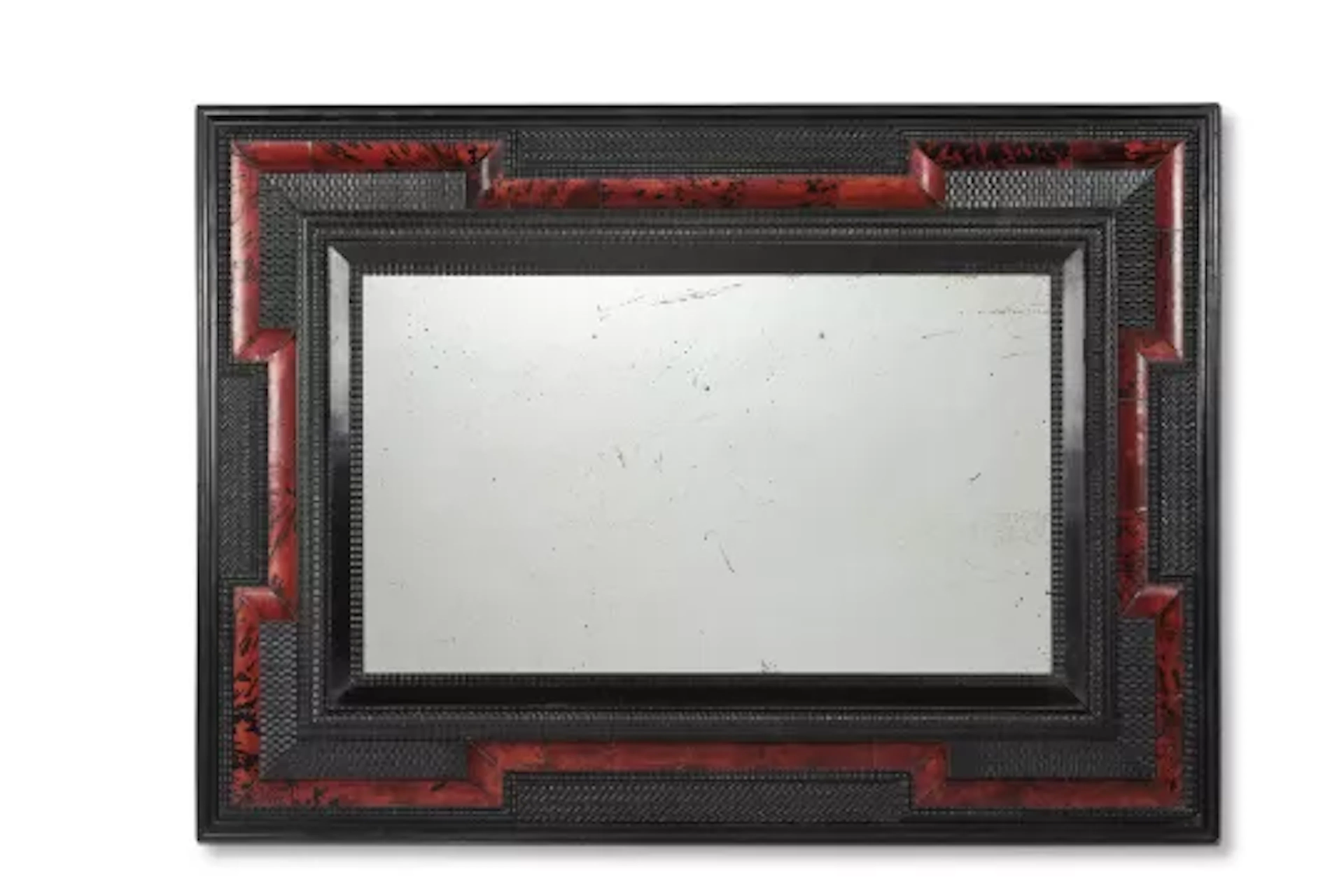 Y A RIPPLE MOULDED EBONISED AND TORTOISESHELL MIRROR, DUTCH, 19TH CENTURY