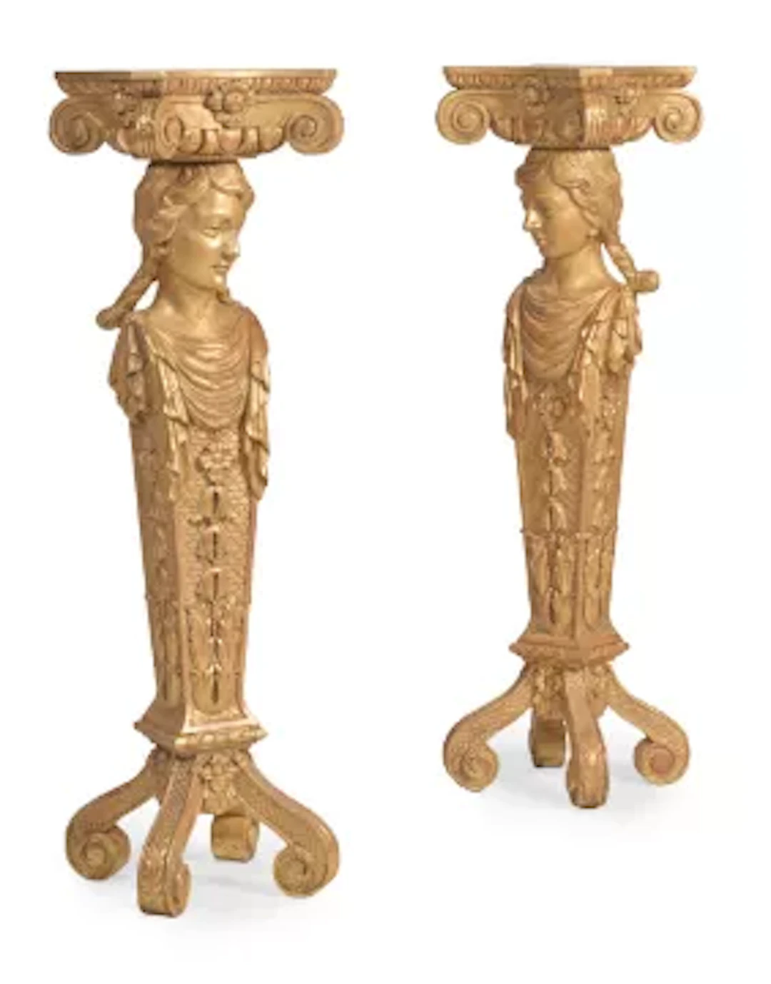 A PAIR OF CARVED GILTWOOD FIGURAL TORCHERES, IN THE MANNER OF WILLIAM
