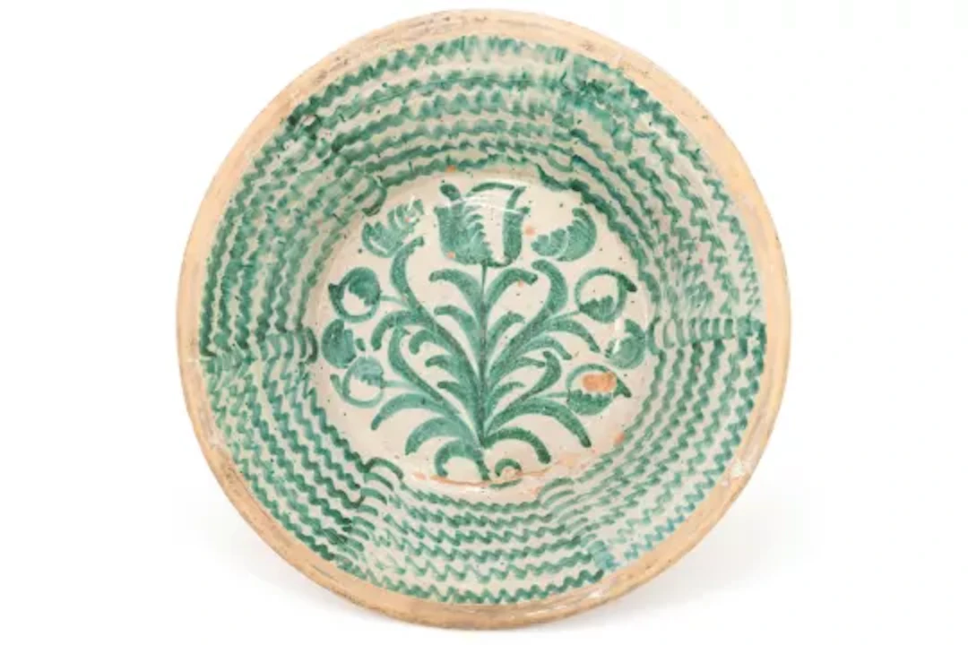 A SPANISH PARTIALLY GLAZED POTTERY LEBRILLO (DOMESTIC BOWL), LATE