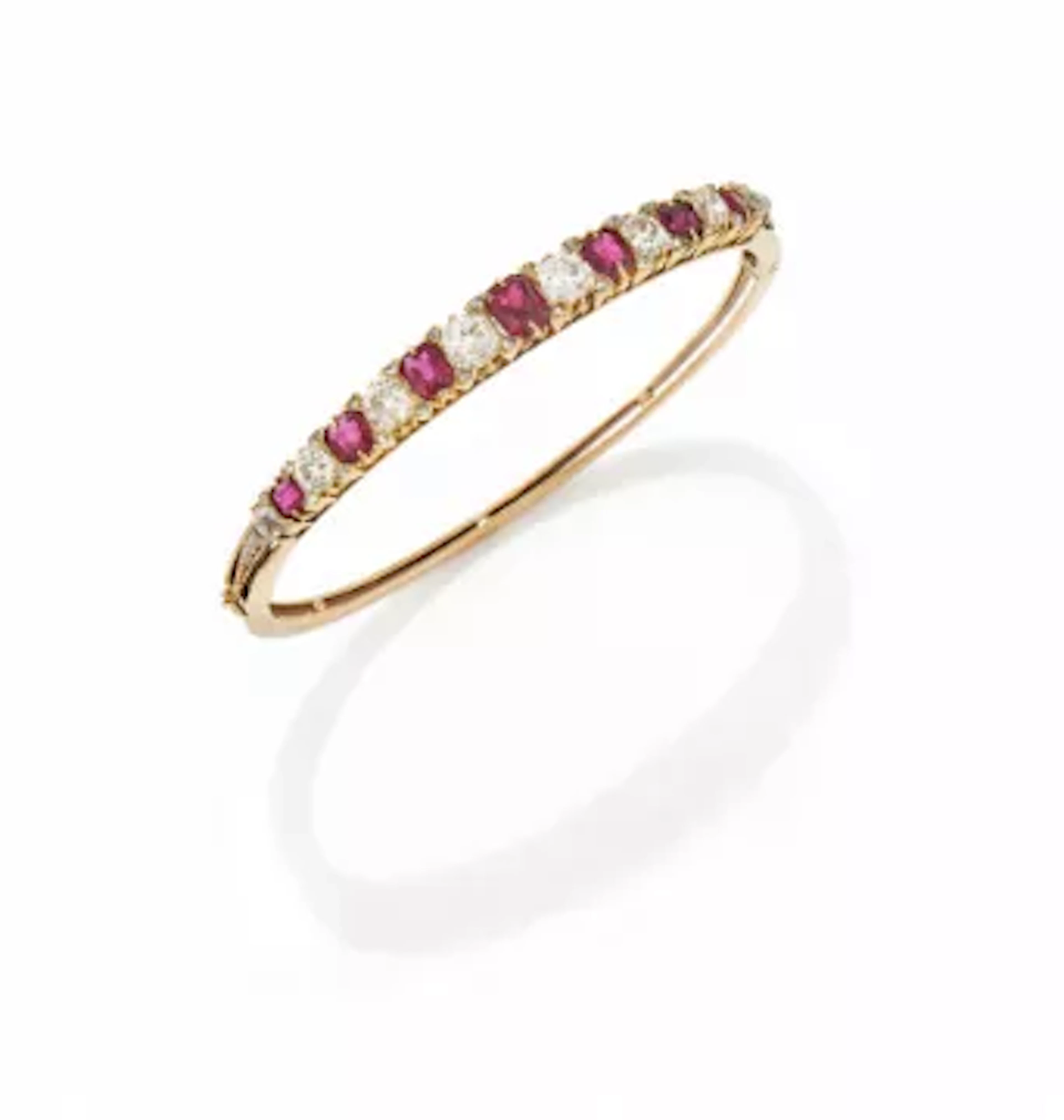 A LATE VICTORIAN RUBY AND DIAMOND HINGED BANGLE, CIRCA 1900