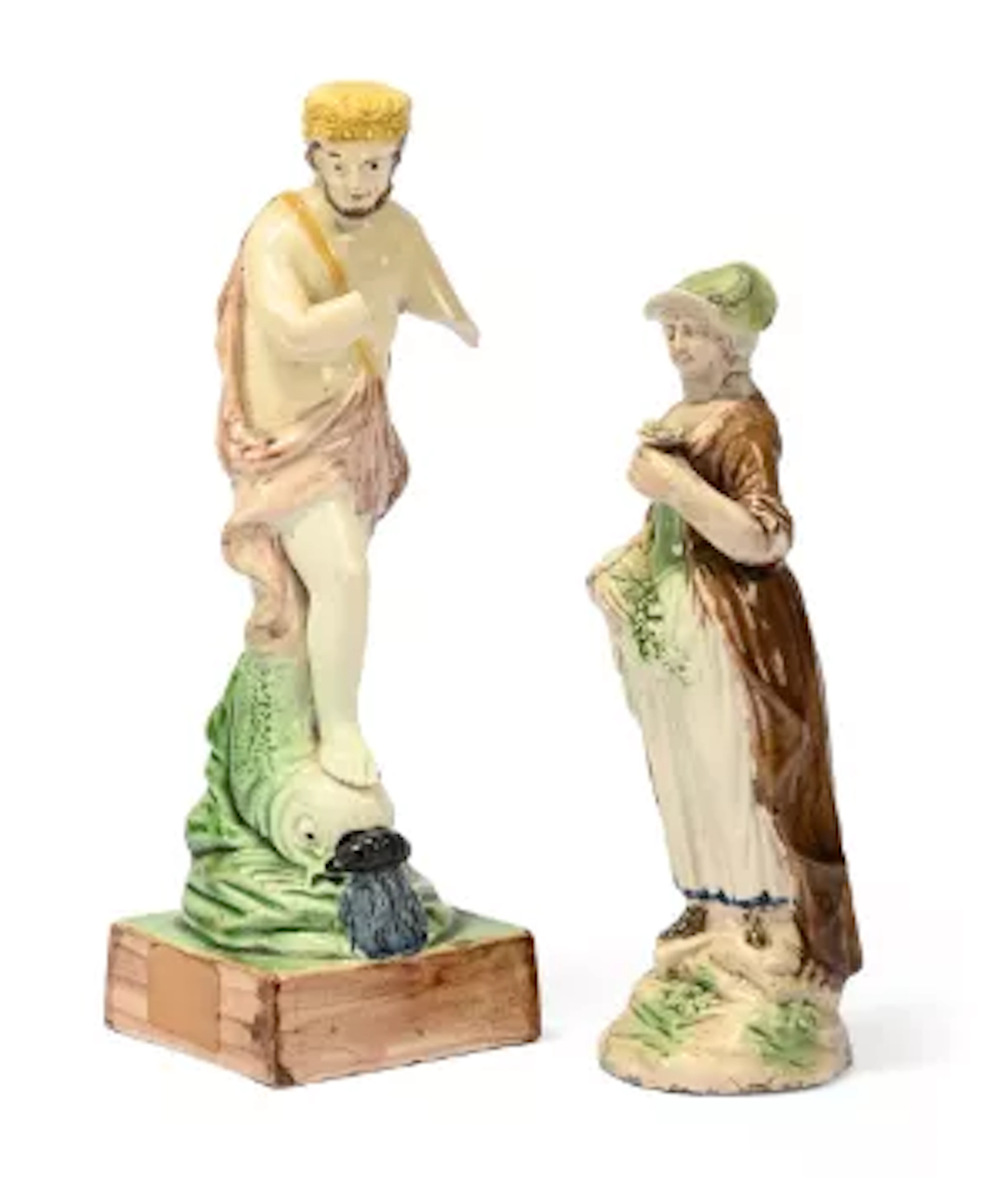 A STAFFORDSHIRE CREAMWARE FIGURE OF A WOMAN, LATE 18TH CENTURY, WITH