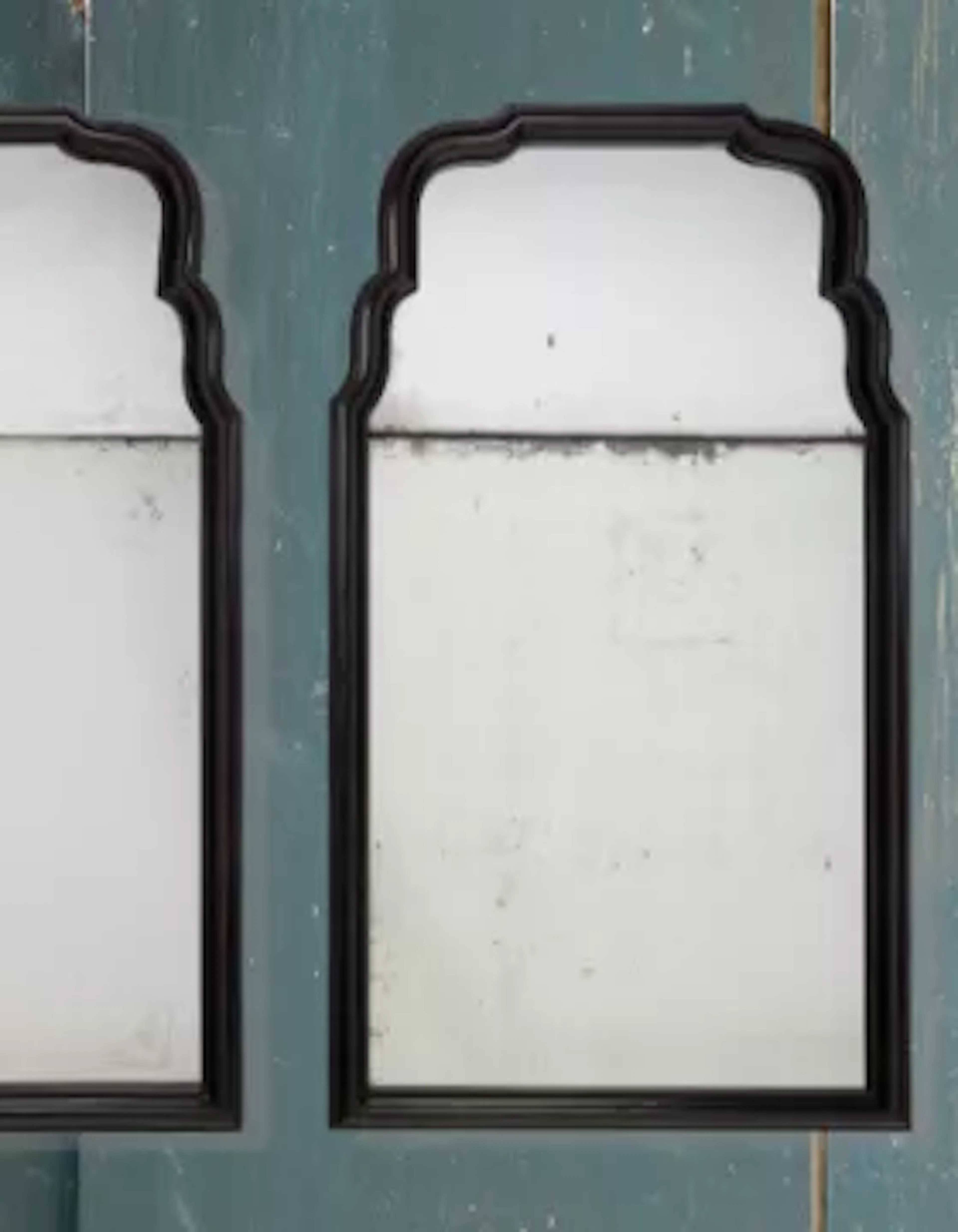 Y A PAIR OF EBONY FRAMED MIRRORS, MODERN, THE MIRRORS ANTIQUE MERCURY