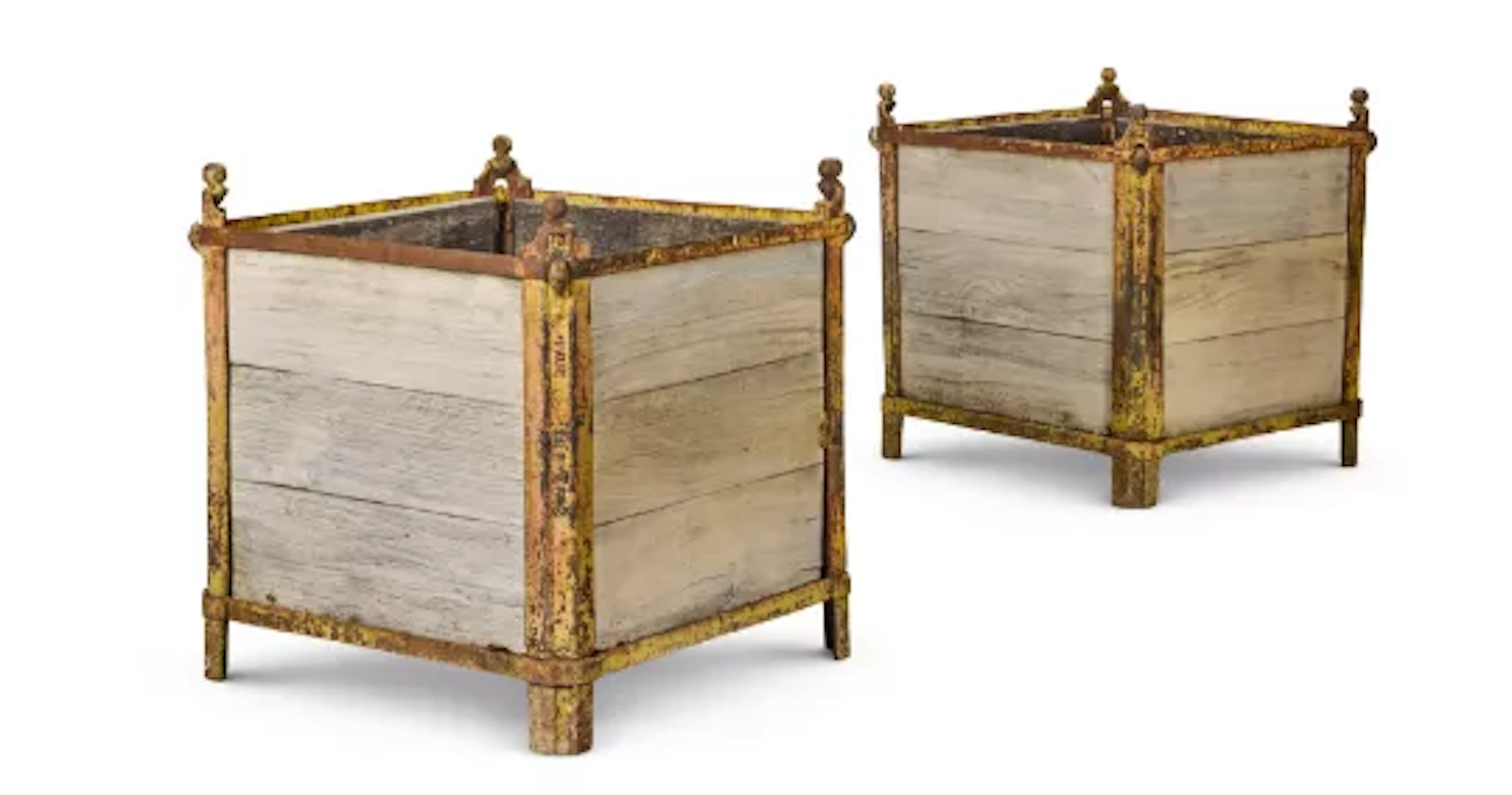 A PAIR OF PAINTED CAST IRON `ORANGERIE' PLANTERS, BY PAUL BORDEAUX, CIRCA 1920