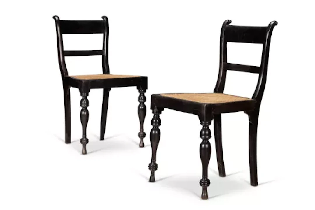 Y A PAIR OF CEYLONESE EBONY AND CANED SIDE CHAIRS, LATE 19TH CENTURY