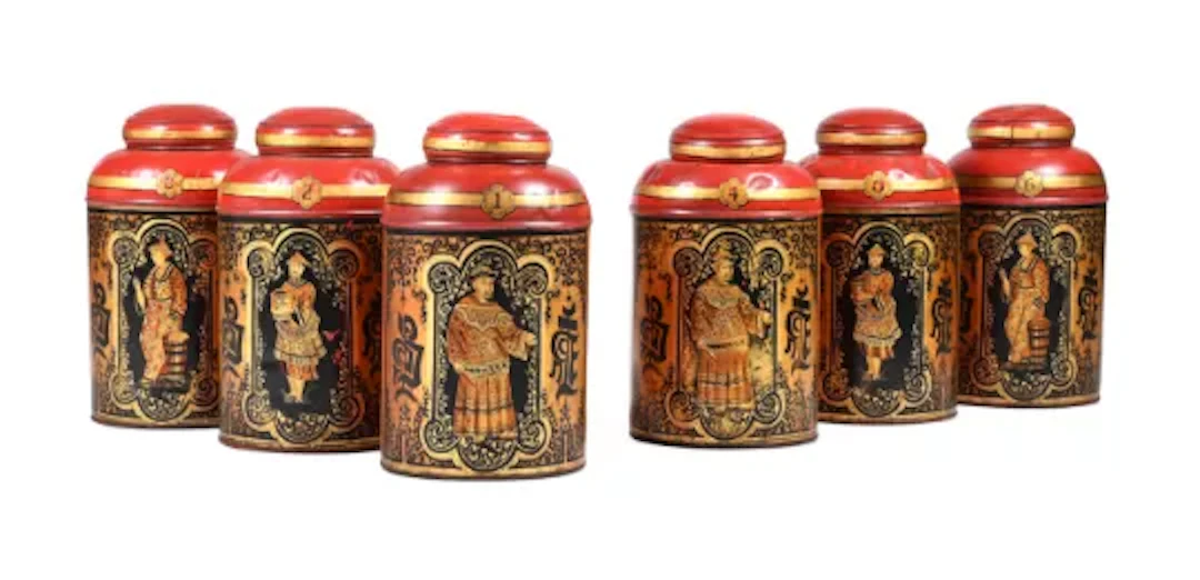 A GROUP OF SIX RED AND GILT CHINOISERIE DECORATED CYLINDRICAL TEA