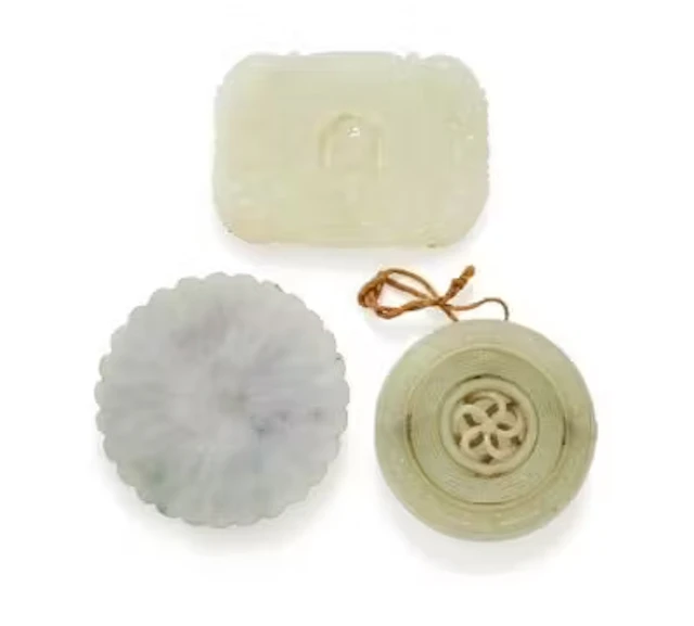 A Chinese white jade articulated archaistic pendant