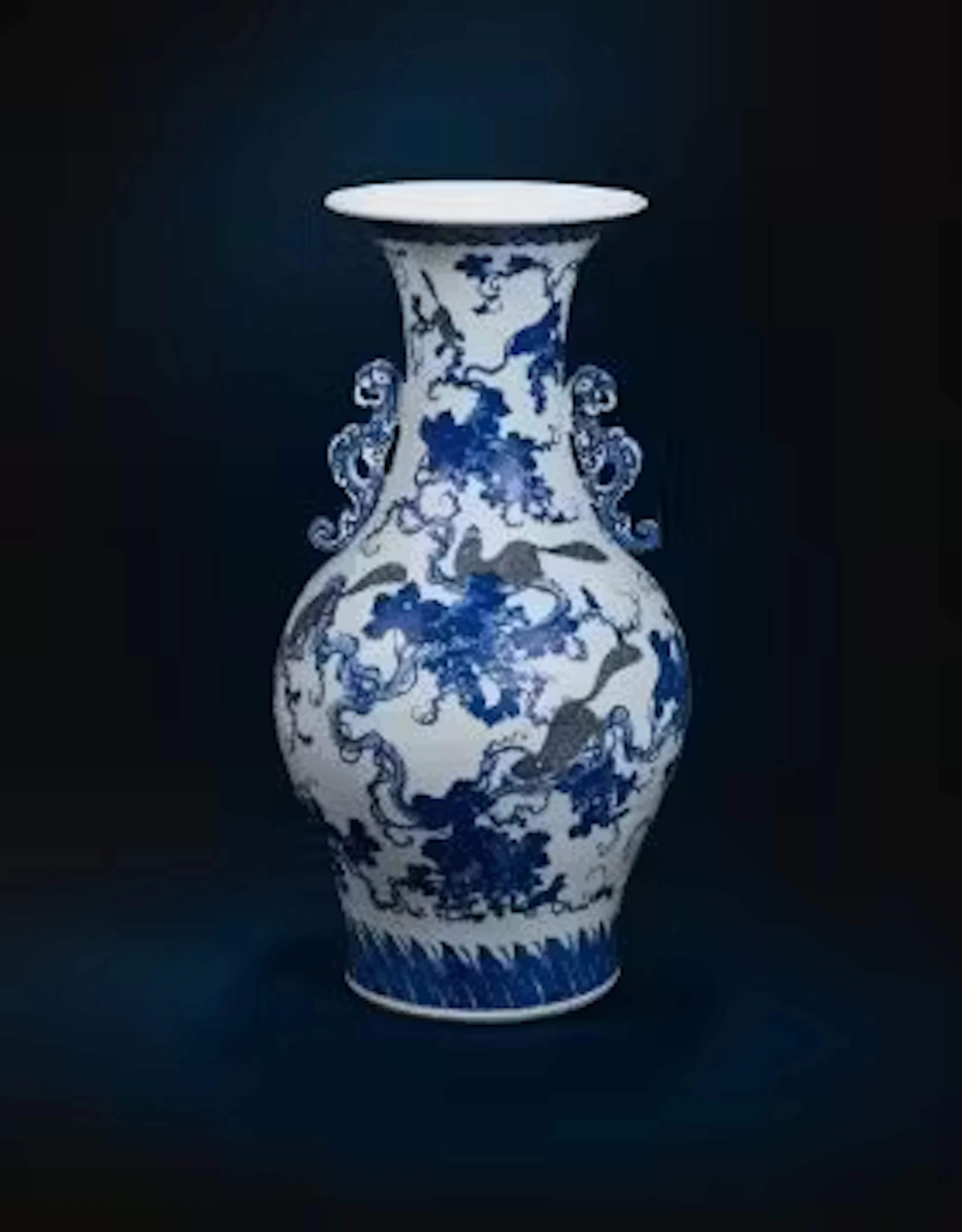 A large Chinese underglaze blue and copper red twin handled vase