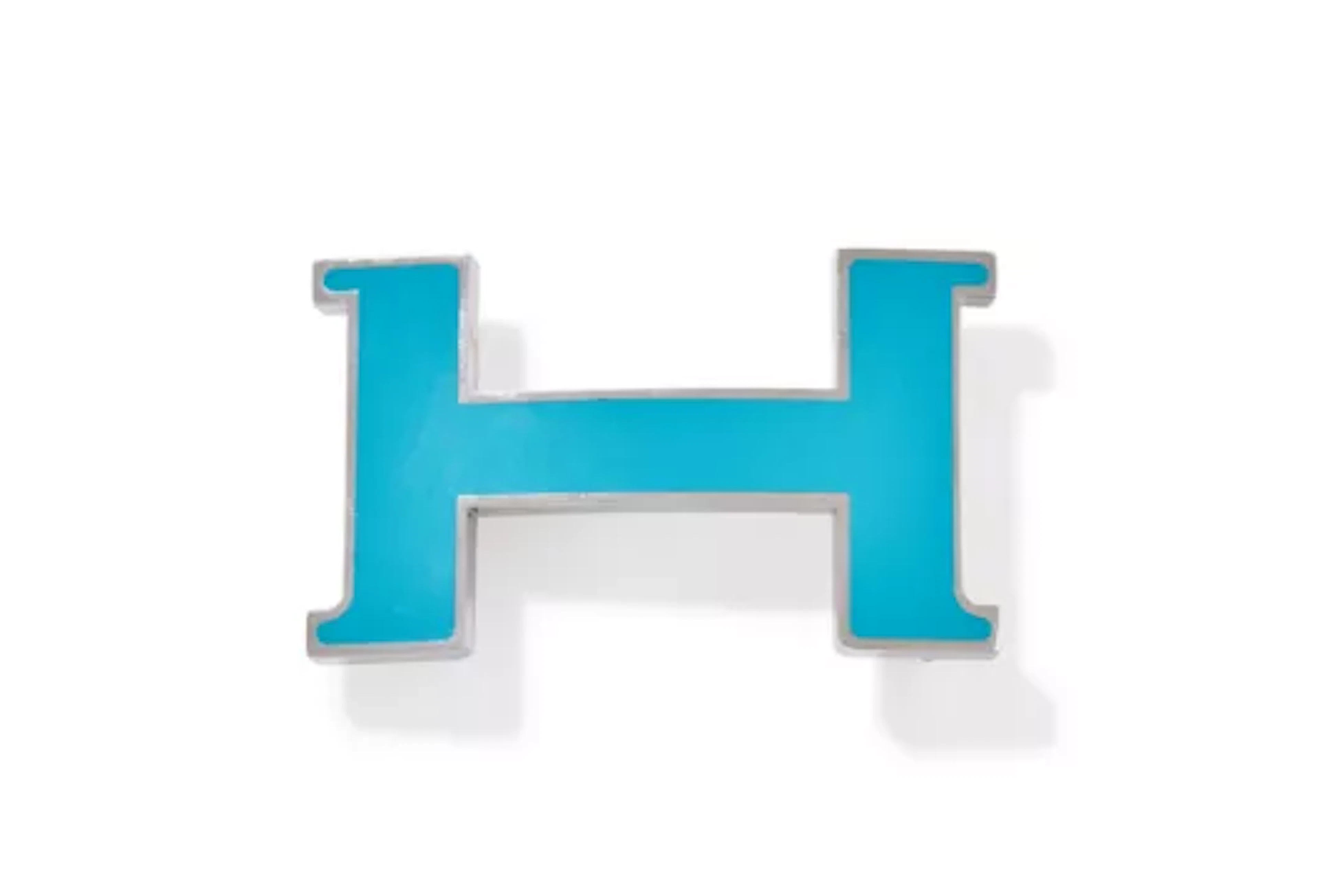 HERMÈS, A STAINLESS STEEL AND BLUE LACQUER H BELT BUCKLE