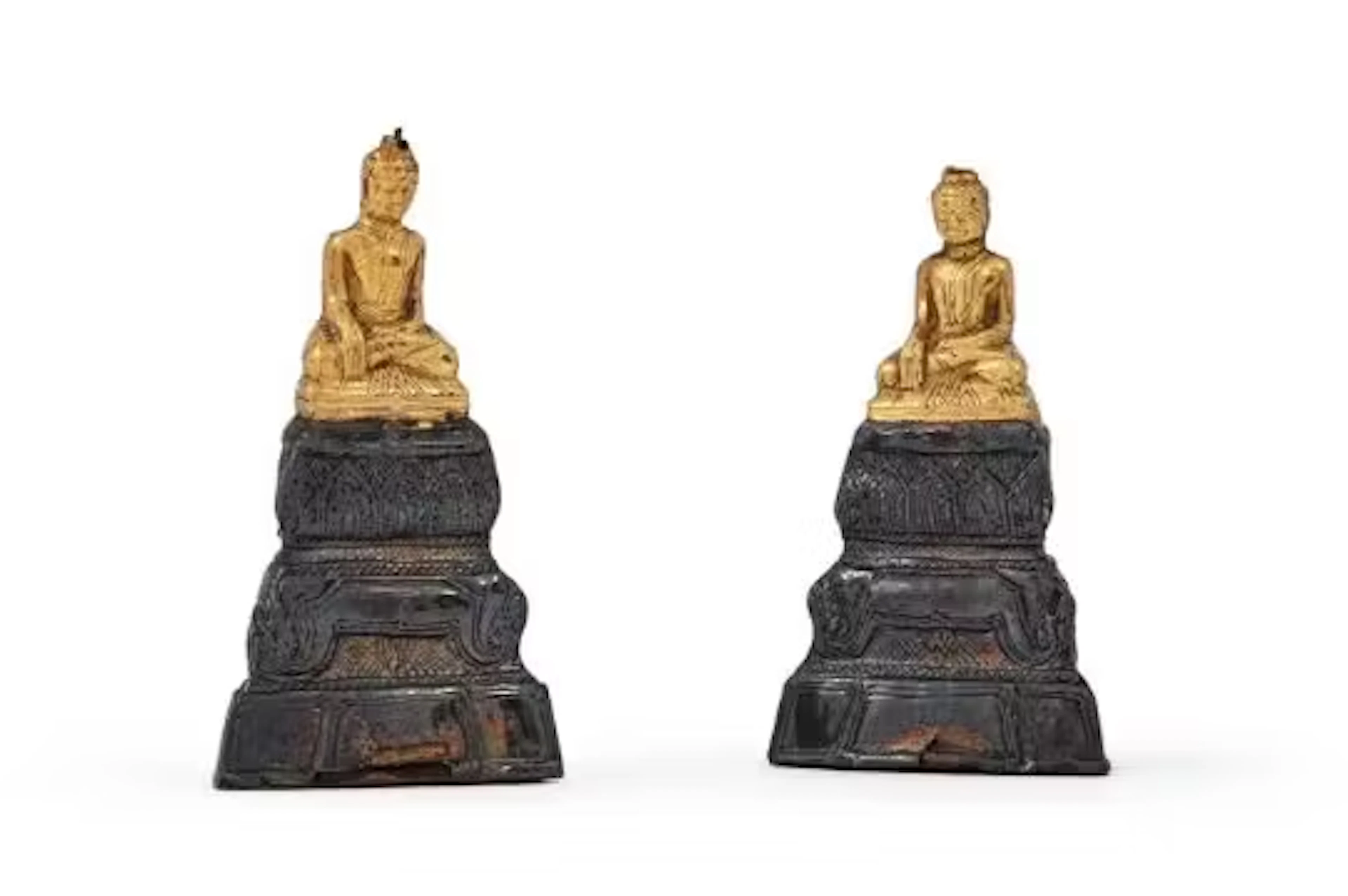 A pair of Siamese gold and silver foil covered pottery figures of Bodhisattva