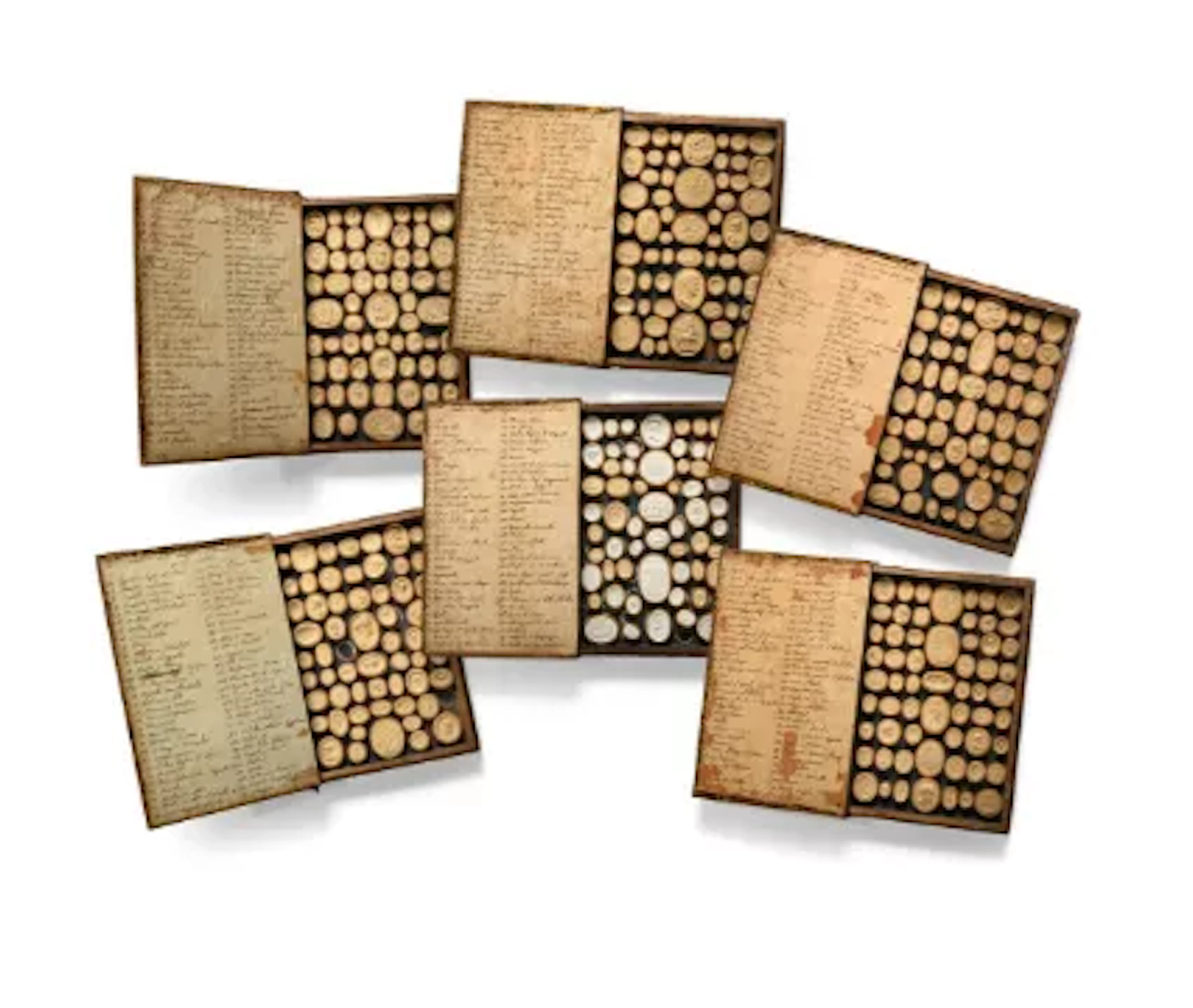 A GRAND TOUR SET OF SIX MARBLED BOOKS CONTAINING INTAGLIOS OR CAMEOS