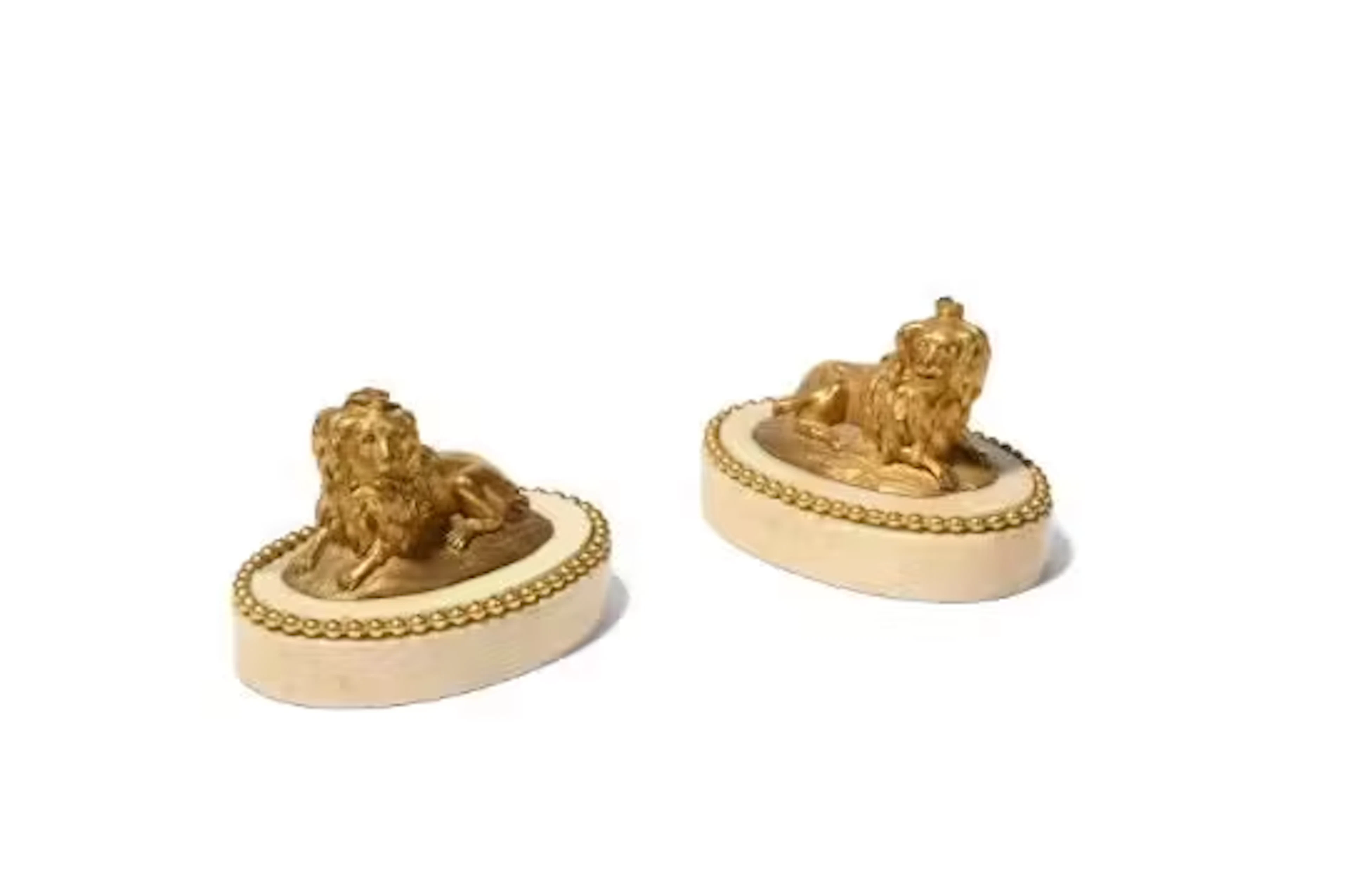 A PAIR OF FRENCH GILT BRONZE DOG PAPERWEIGHTS OR PRESSE PAPIERS, LATE