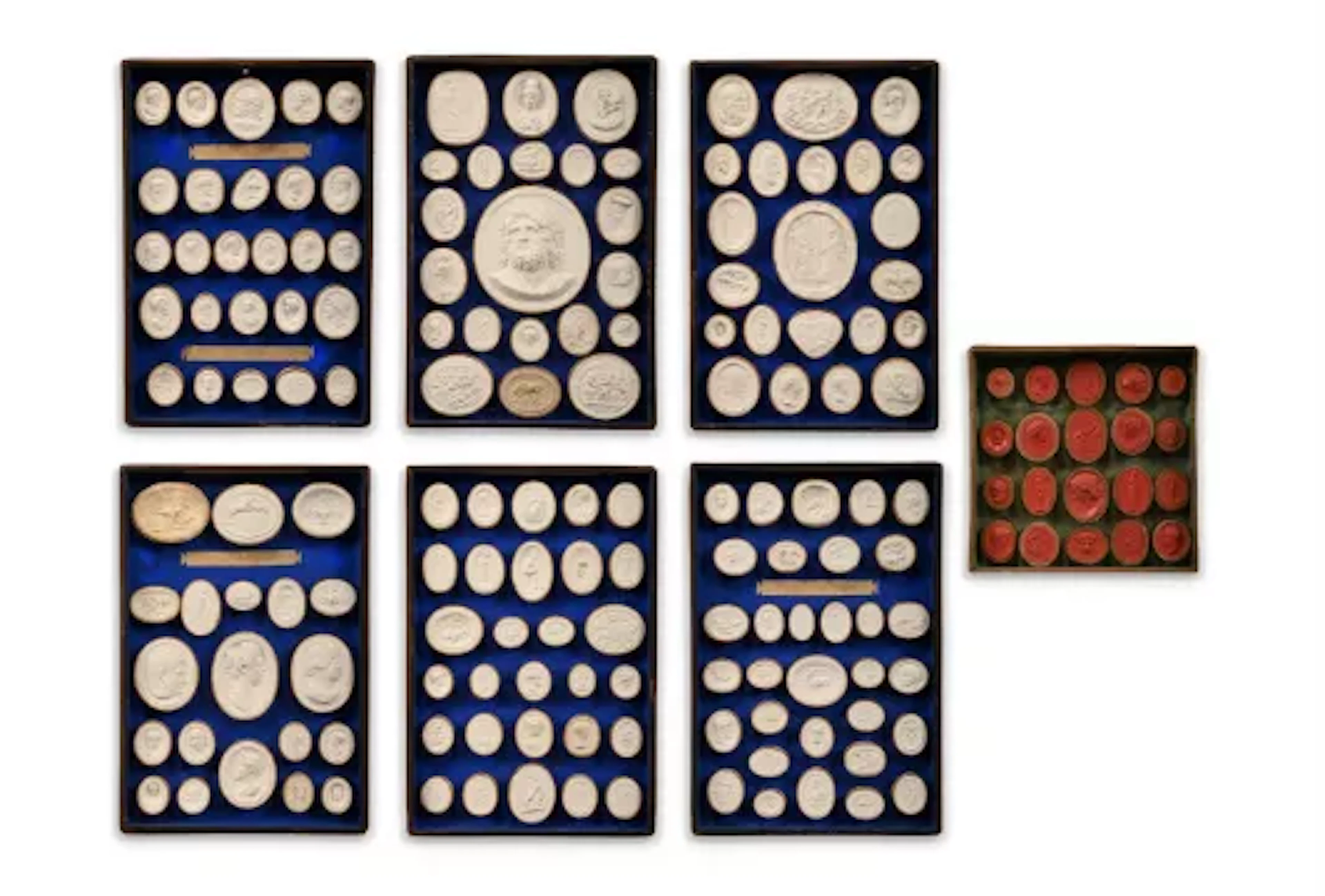A SET OF FIVE TRAYS OF GRAND TOUR PLASTER INTAGLIOS, EARLY 19TH CENTURY