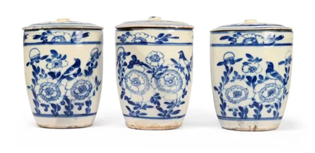 A SET OF THREE BLUE AND WHITE TIN GLAZED EARTHENWARE LIDDED STORAGE