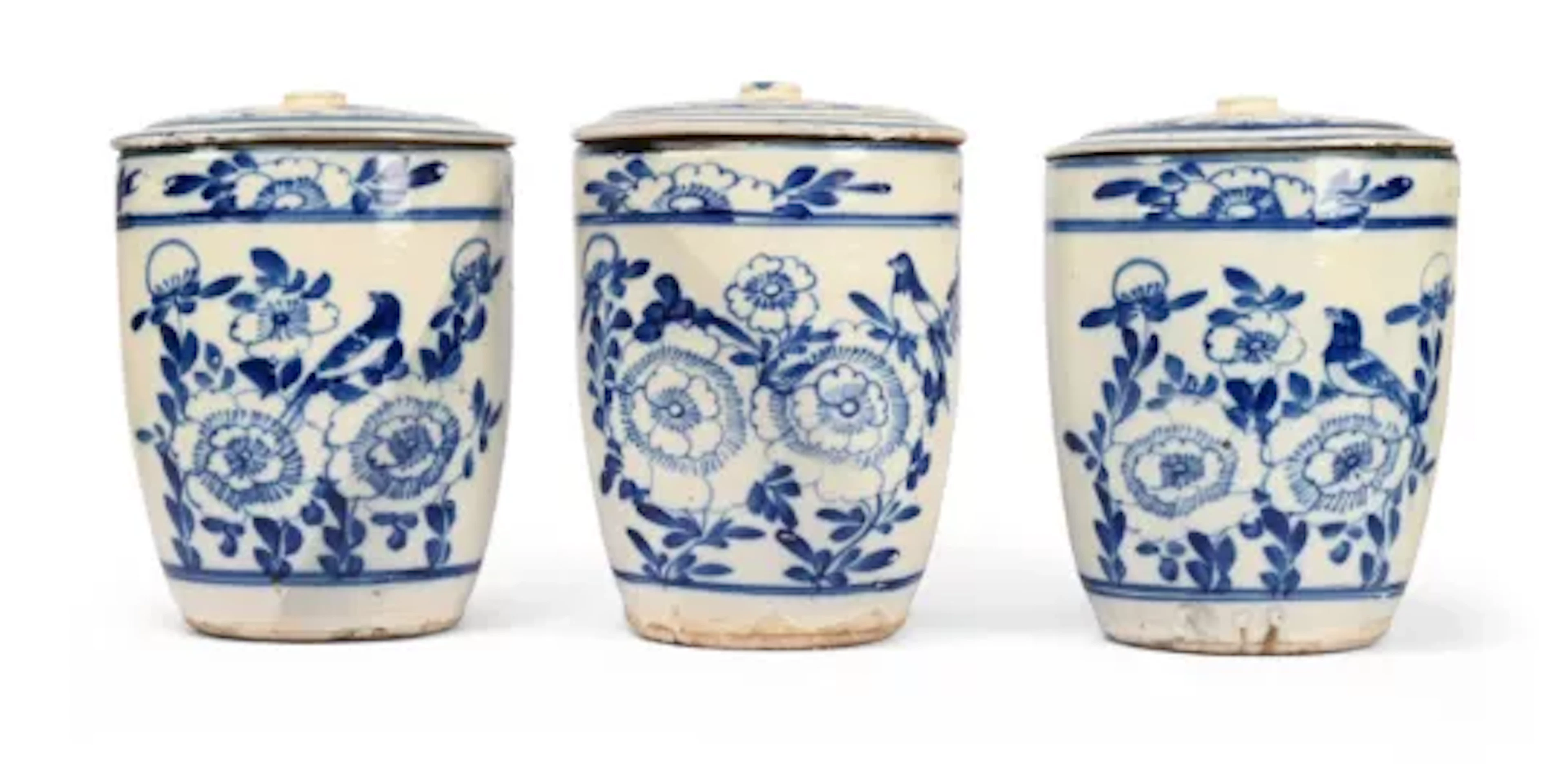 A SET OF THREE BLUE AND WHITE TIN GLAZED EARTHENWARE LIDDED STORAGE