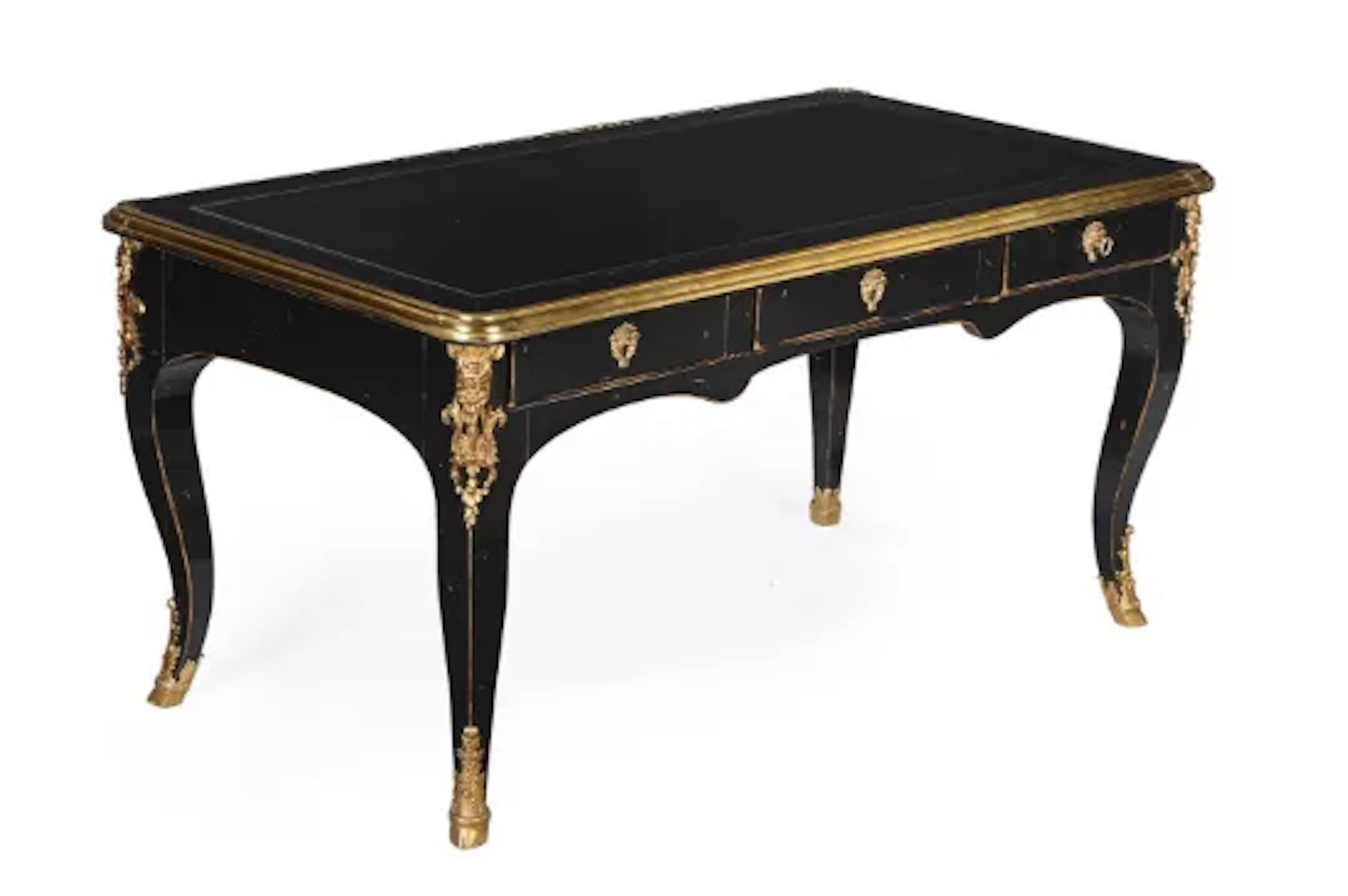 A LOUIS XV STYLE EBONISED BUREAU PLAT OR LIBRARY WRITING TABLE, LAST