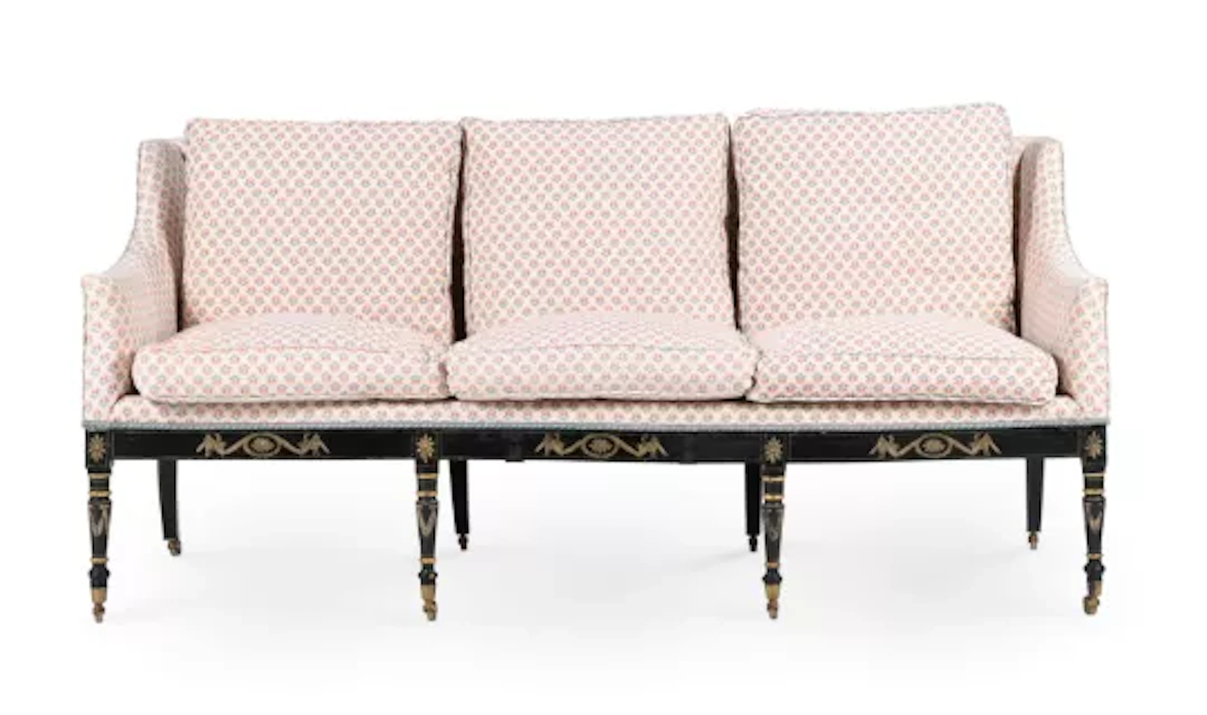 A GEORGE III EBONISED, PAINTED AND FLORAL UPHOLSTERED SETTEE, CIRCA 1810