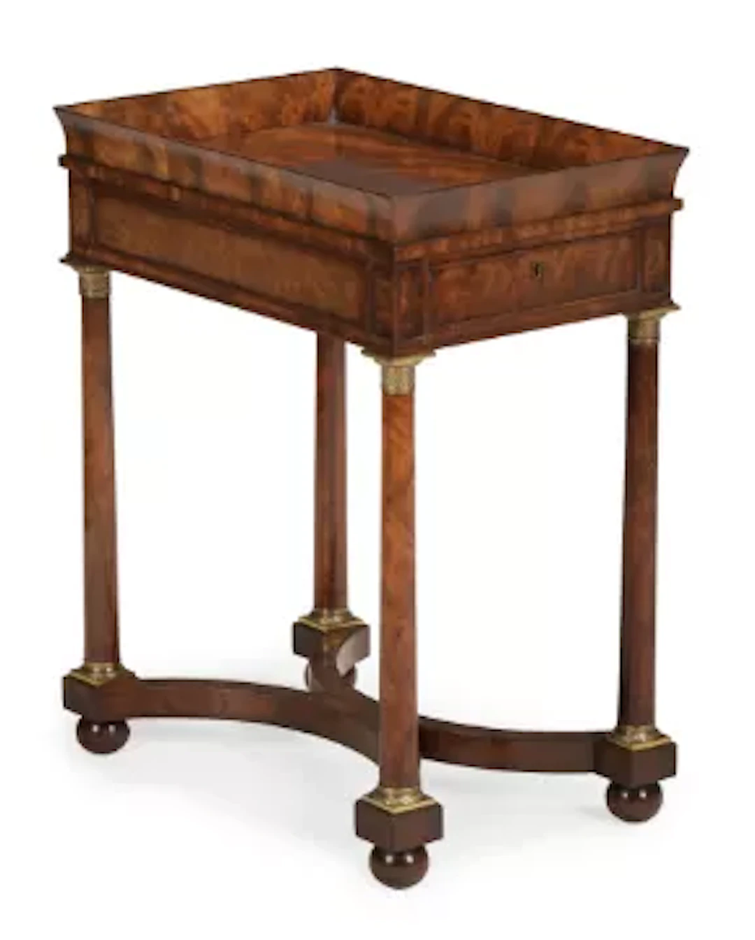 A REGENCY MAHOGANY AND GILT BRASS MOUNTED TABLE, IN THE MANNER OF