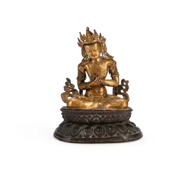 A large copper-gilt repousse figure of Vajradhara, Tibet, 15th or 16th century