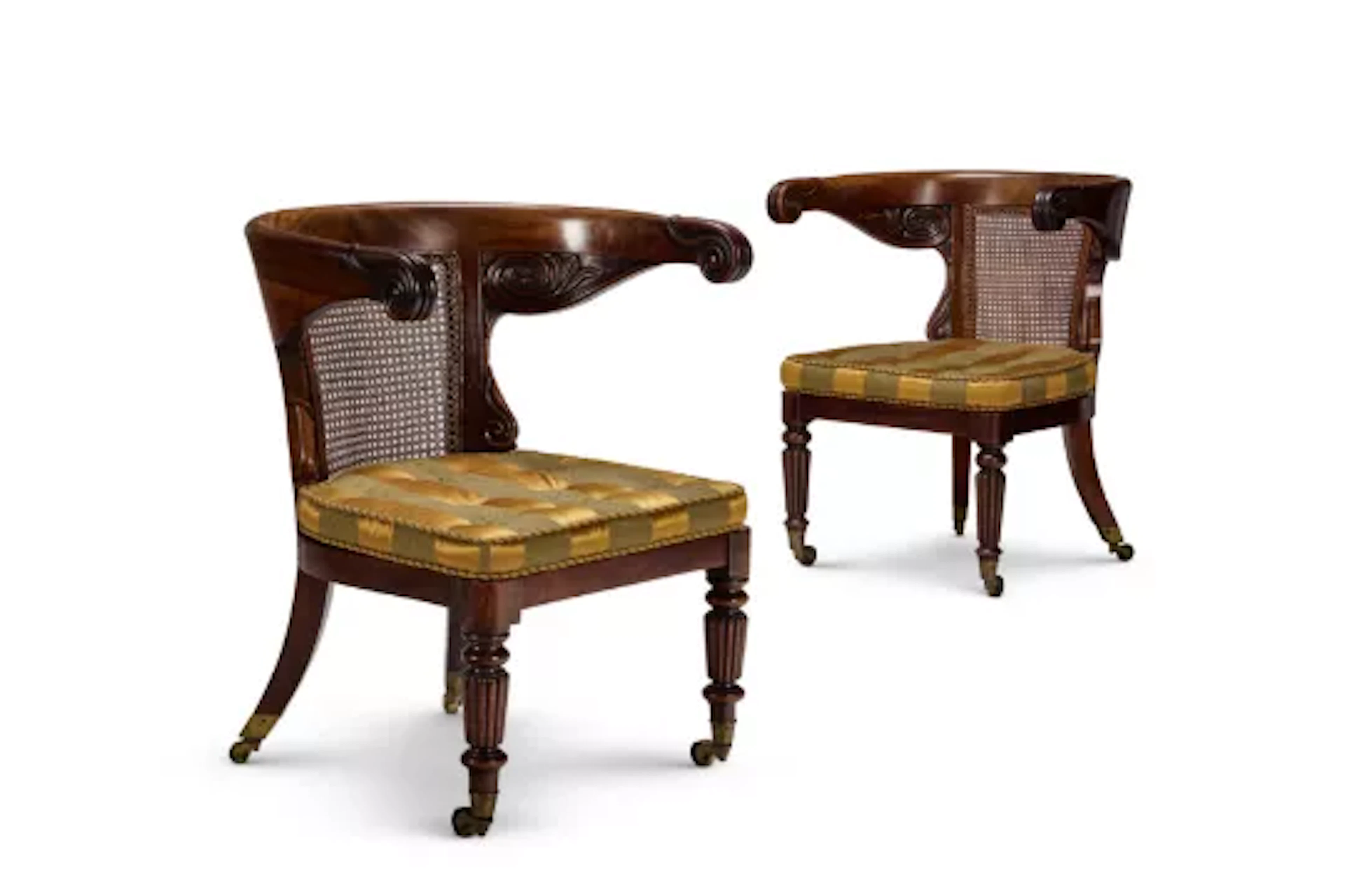 A MATCHED PAIR OF REGENCY MAHOGANY AND CANED 'KLISMOS' LIBRARY ARMCHAIRS