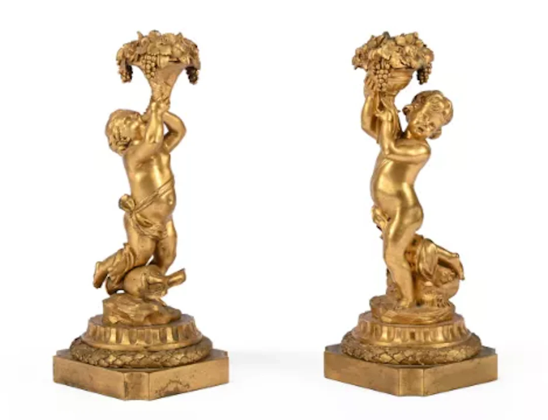 A PAIR OF GILT BRONZE CHERUB CANDELABRA, IN THE MANNER OF HENRI DASSON