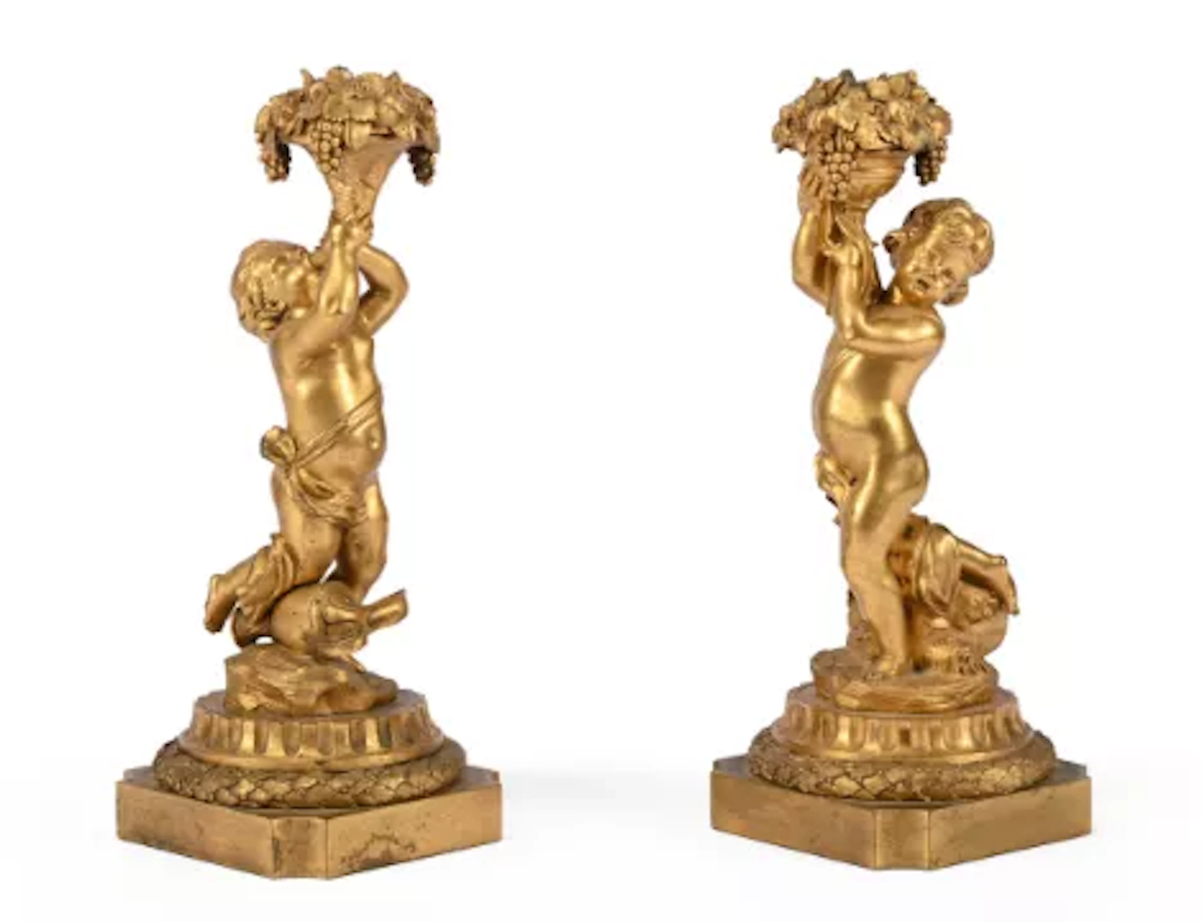A PAIR OF GILT BRONZE CHERUB CANDELABRA, IN THE MANNER OF HENRI DASSON