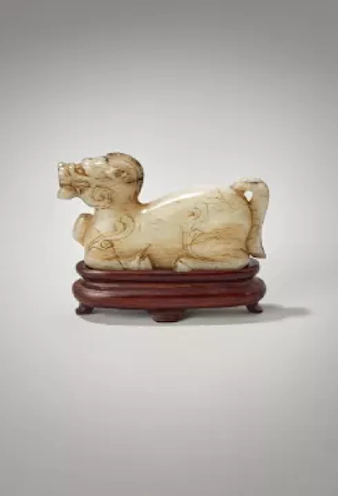 A Chinese white and grey jade carved mythical beast, tianma, Han Dynasty