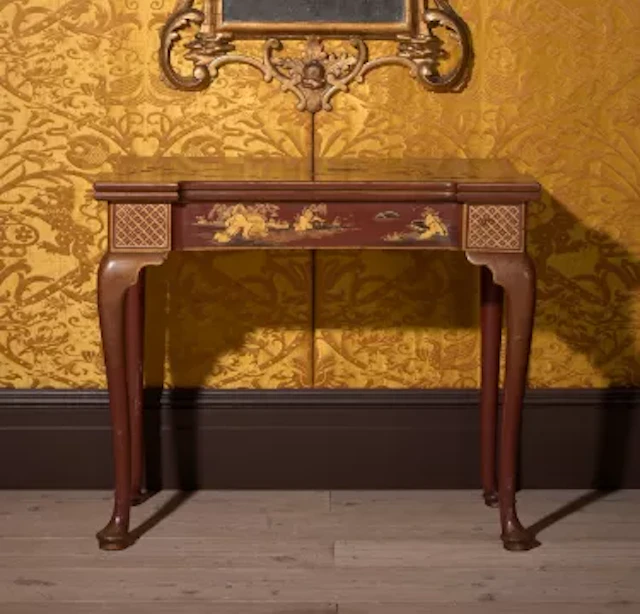 A FINE GEORGE II SCARLET LACQUER AND GILT JAPANNED FOLDING CARD TABLE