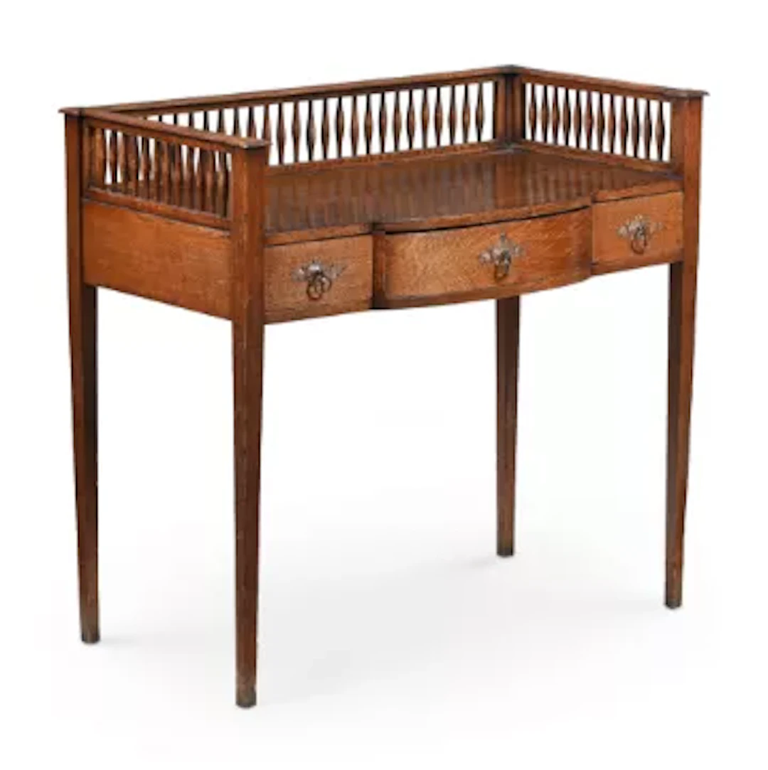 AN ARTS & CRAFTS OAK GALLERY BACKED SIDE TABLE, BY BLADONS OF HULL