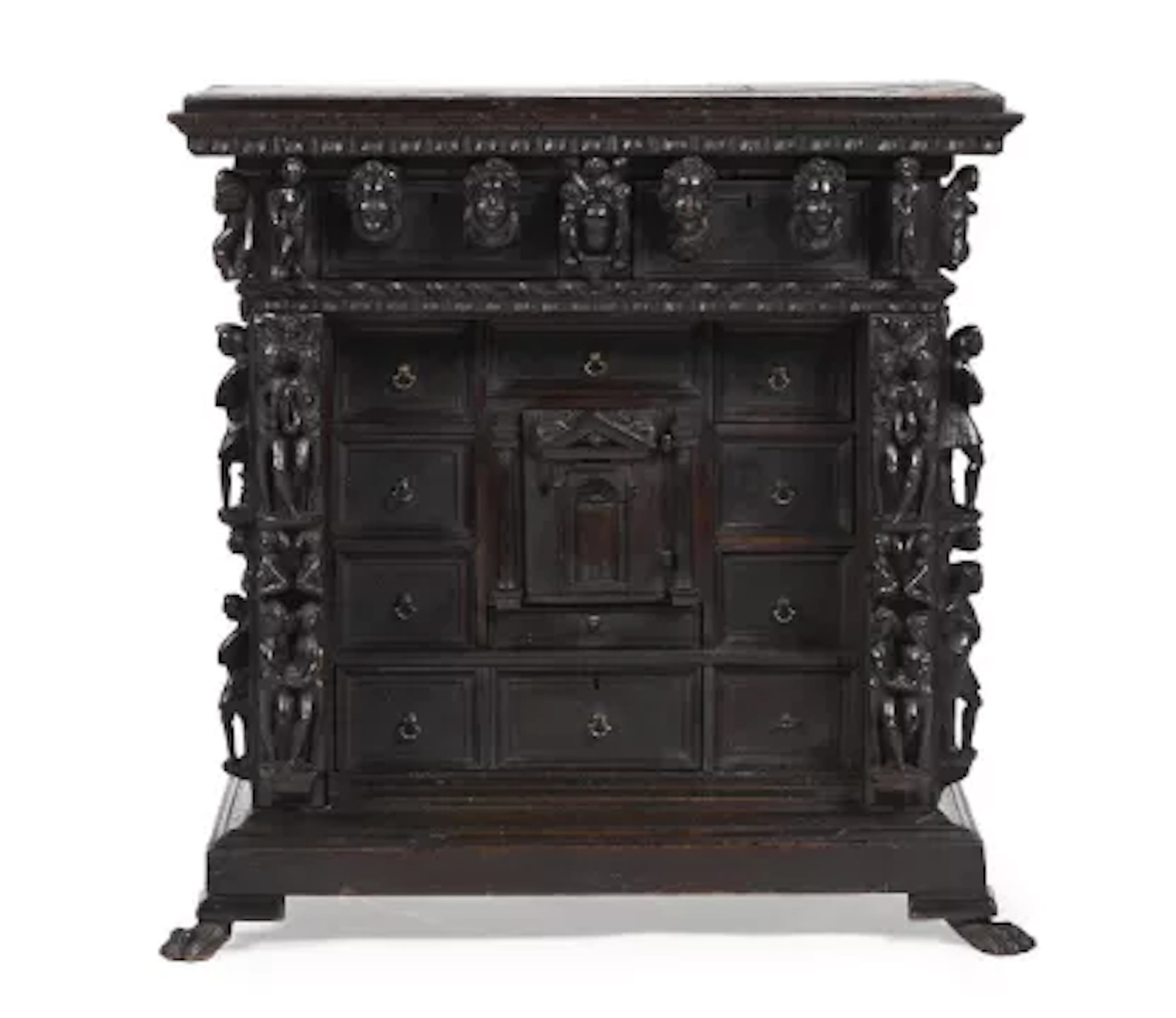 AN ITALIAN CARVED WALNUT TABLE CABINET, EARLY 17TH CENTURY