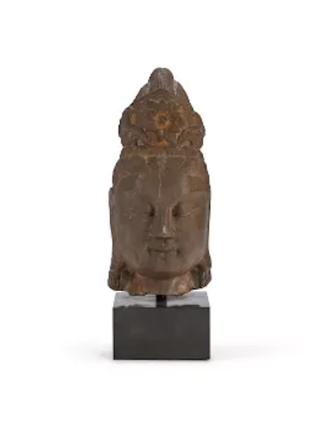 A Chinese carved stone buddha head, Ming or Qing dynasty