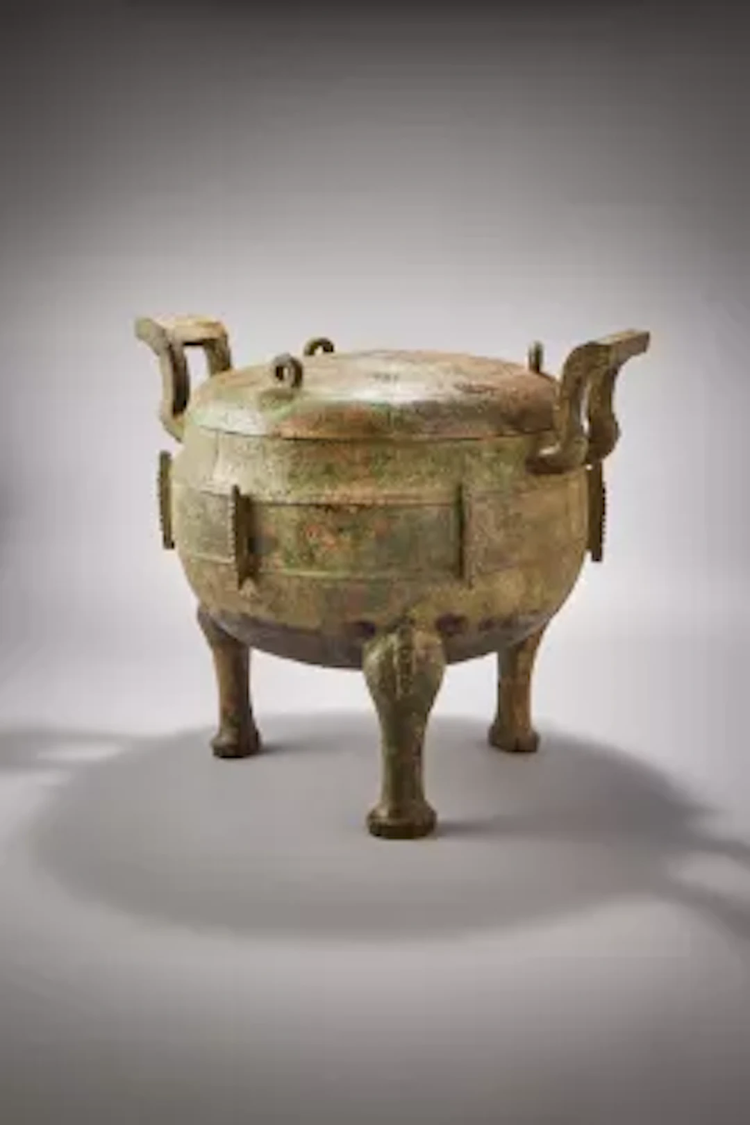 A large Chinese bronze archaic food vessel and cover, ding, Eastern