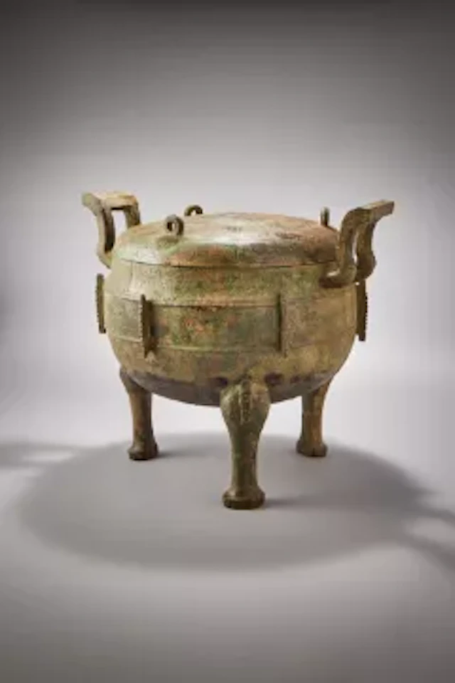 A large Chinese bronze archaic food vessel and cover, ding, Eastern