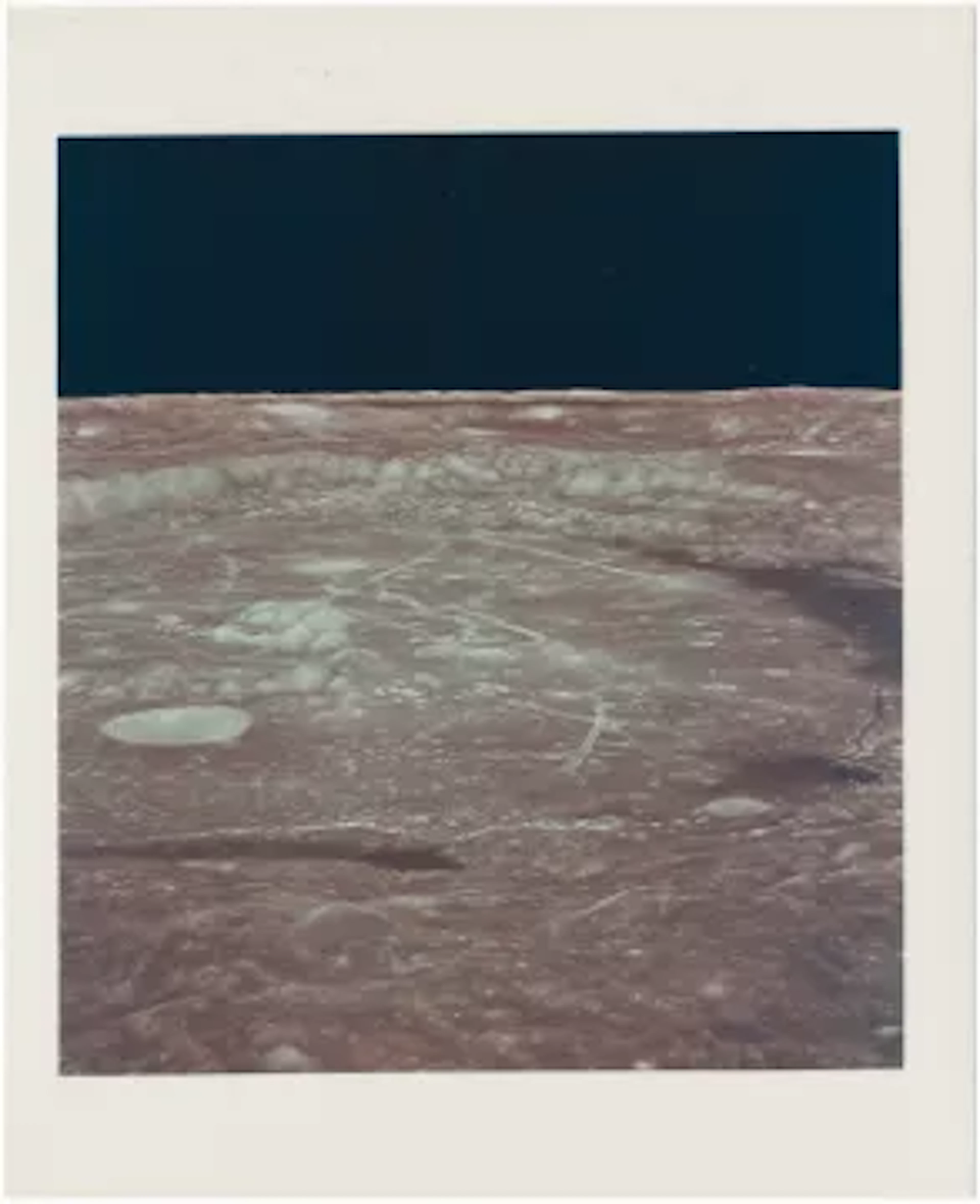 [Apollo 12] DRAMATIC LUNAR HORIZON OVER THE FLOOR OF CRATER HUMBOLDT