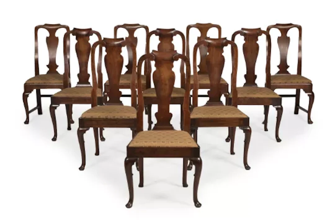 A MATCHED SET OF TEN GEORGE II 'RED WALNUT' SIDE CHAIRS, CIRCA 1730