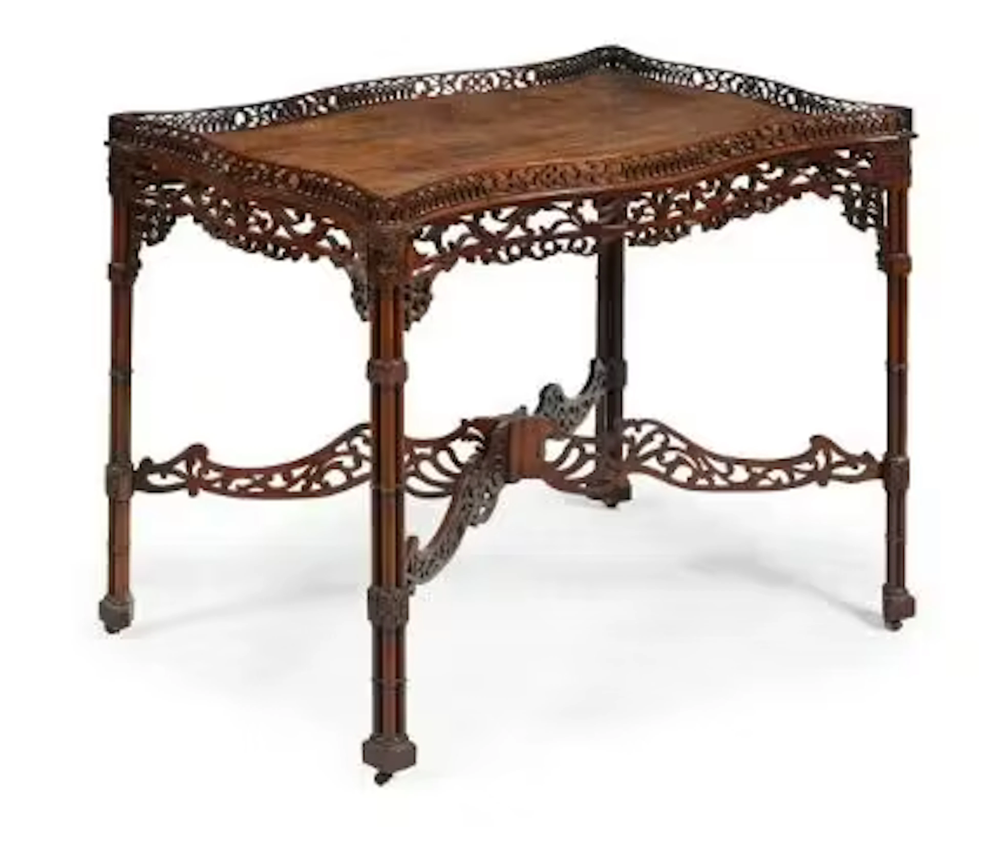 A MAHOGANY SERPENTINE FRETWORK SILVER TABLE, PROBABLY LATE 19TH TO
