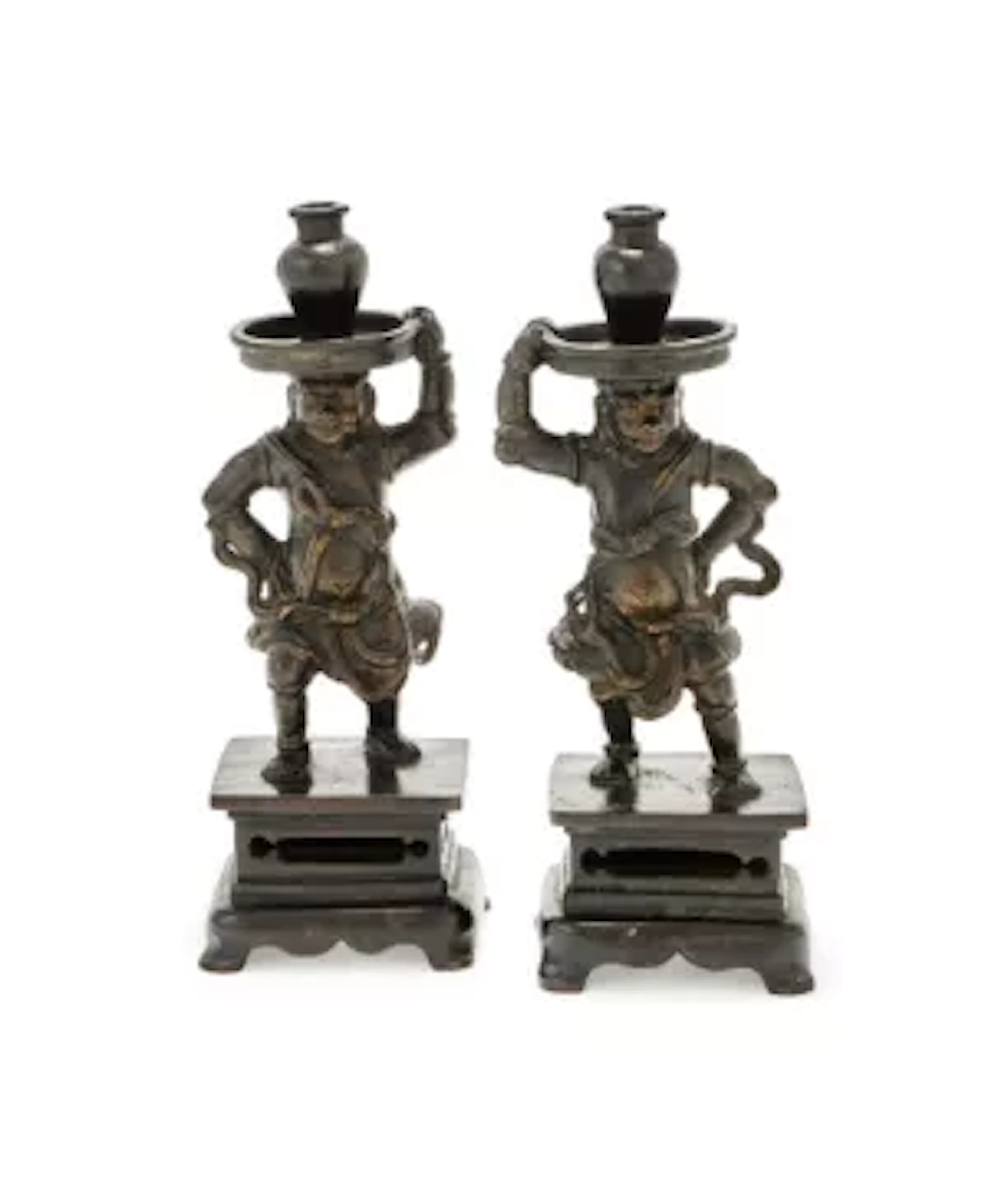 A pair of Chinese 'Foreigner' candlesticks, Ming dynasty, 17th century