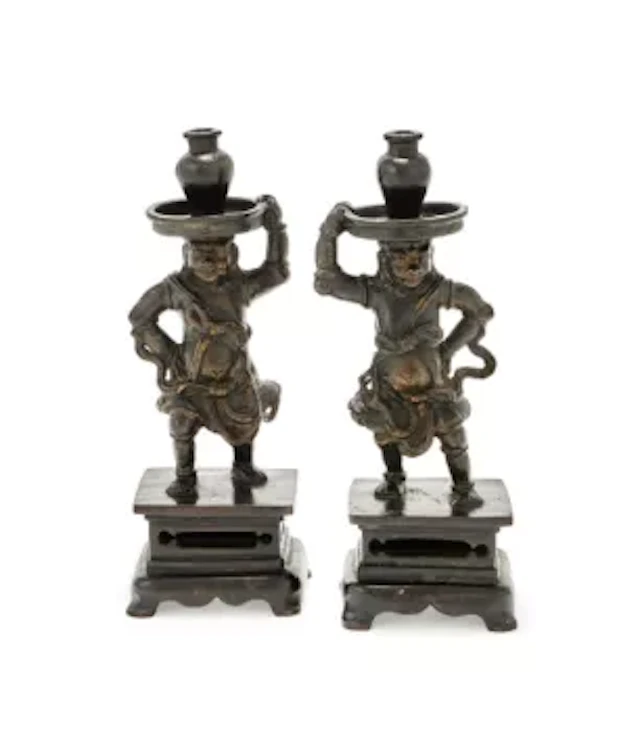 A pair of Chinese 'Foreigner' candlesticks, Ming dynasty, 17th century