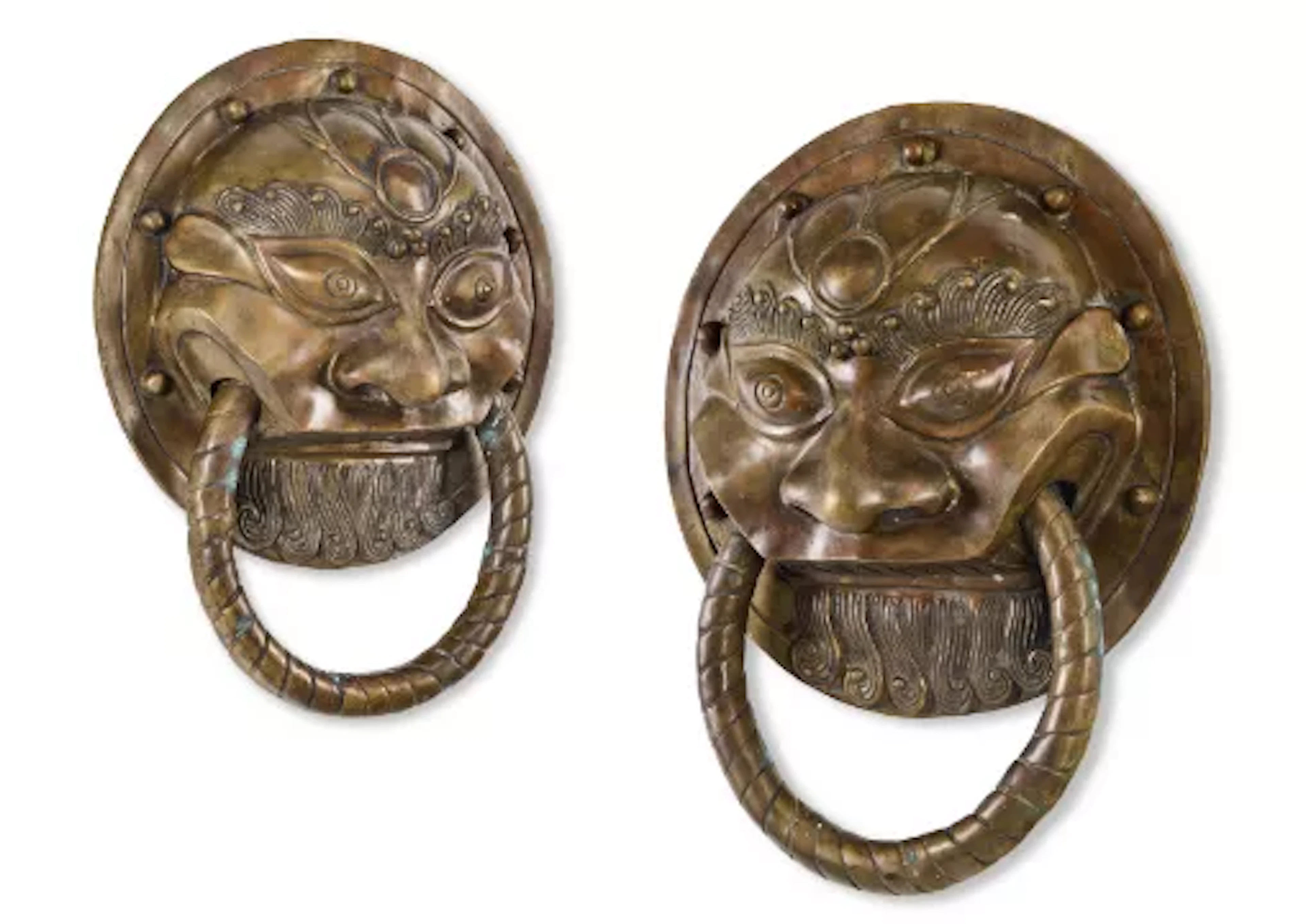 A PAIR OF BRASS TEMPLE DOOR ORNAMENTS, NEPALESE, EARLY 20TH CENTURY