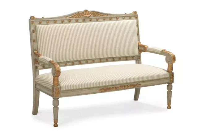 A CONTINENTAL PAINTED AND PARCEL GILT SETTEE, PROBABLY SWEDISH, EARLY