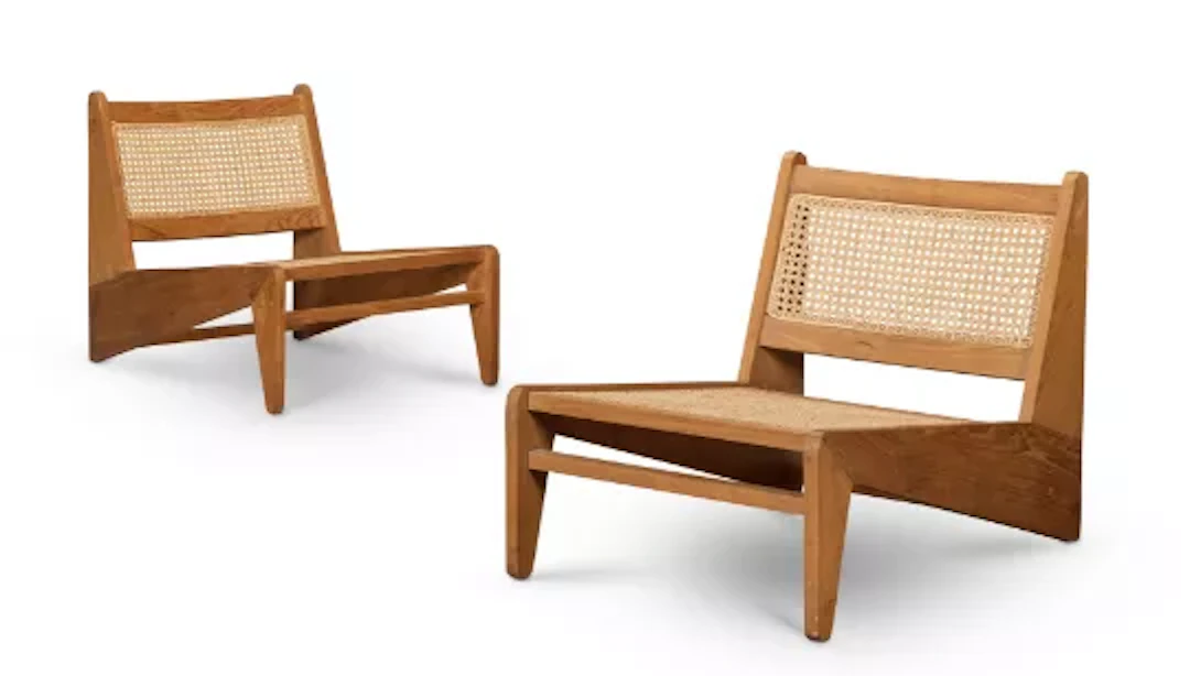 PAIR OF TEAK AND CANED 'KANGAROO' CHAIRS, LATE 20TH CENTURY, AFTER