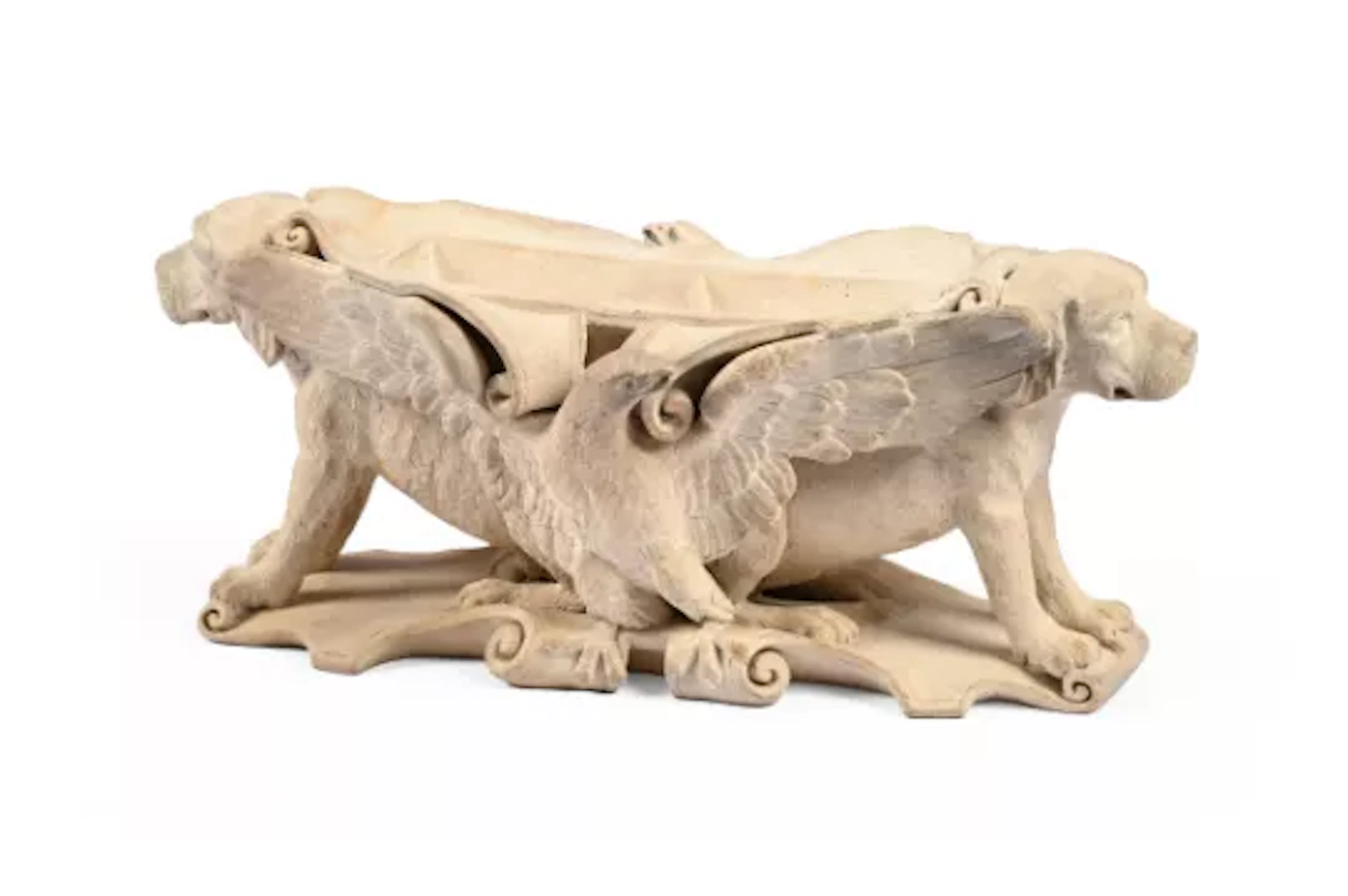 A TERRACOTTA INKWELL ADORNED WITH DOGS AND EAGLES, IN THE STYLE OF
