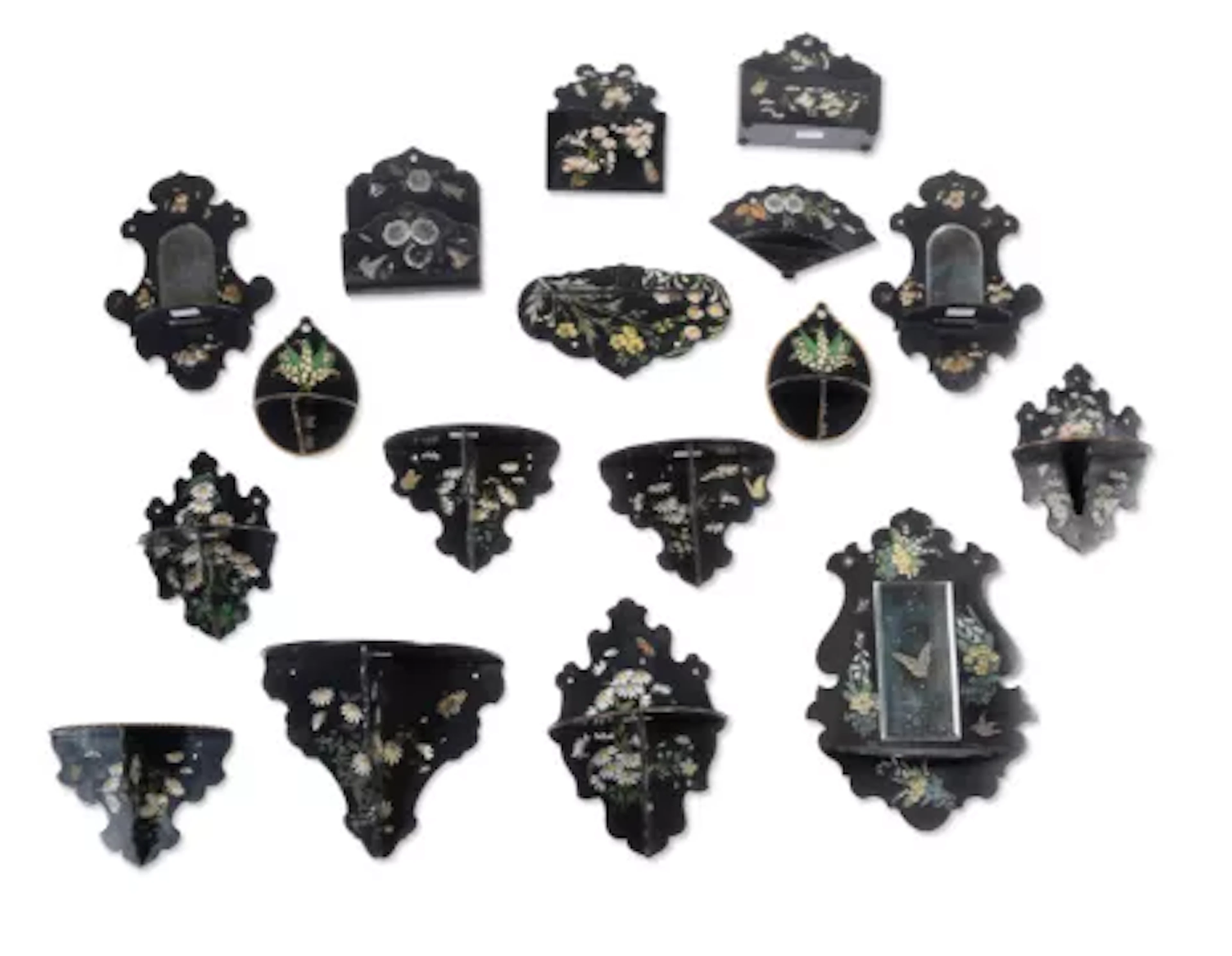 A COLLECTION OF VICTORIAN BLACK LACQUER PAPIER MACHE WALL BRACKETS