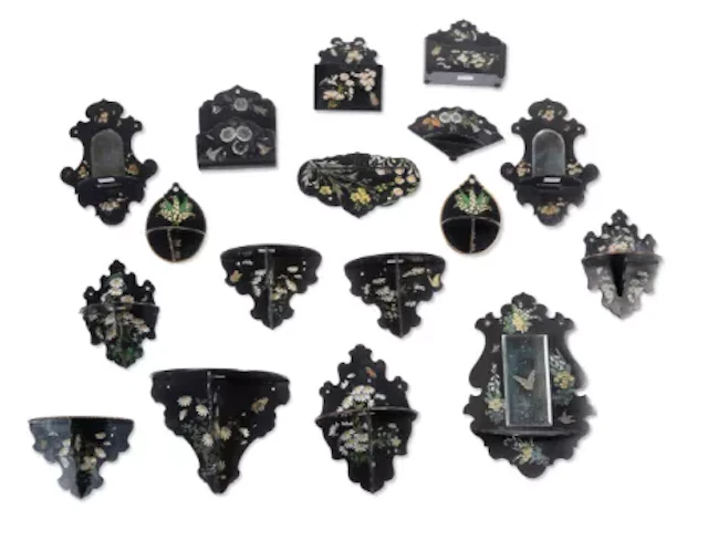 A COLLECTION OF VICTORIAN BLACK LACQUER PAPIER MACHE WALL BRACKETS