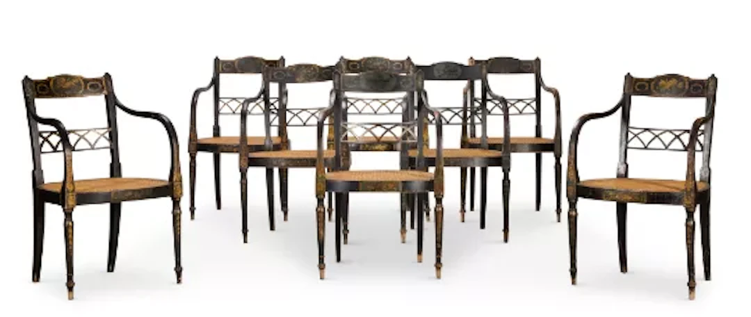 ‡ A SET OF EIGHT GEORGE III POLYCHROME PAINTED AND PARCEL GILT ARMCHAIRS