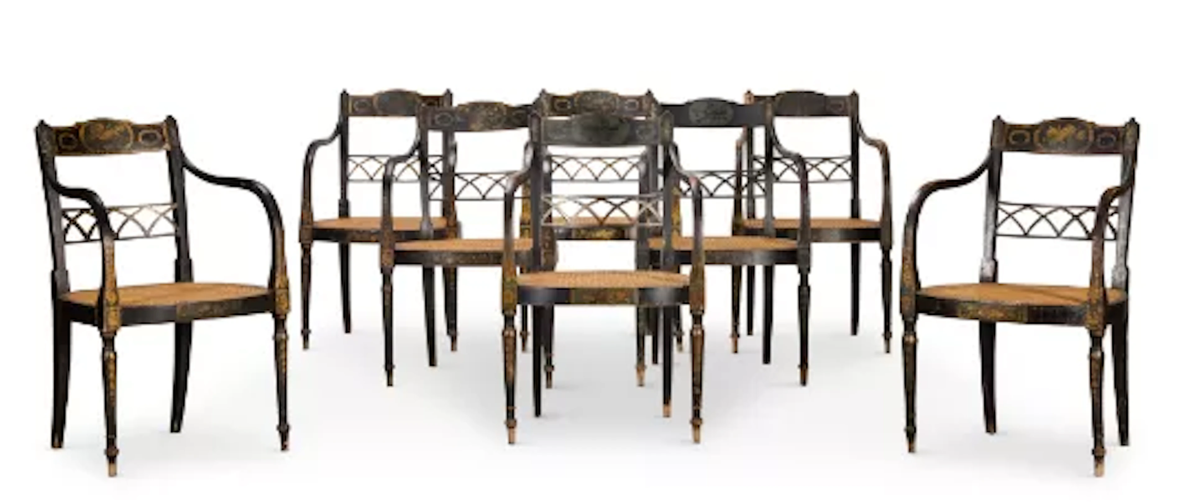 ‡ A SET OF EIGHT GEORGE III POLYCHROME PAINTED AND PARCEL GILT ARMCHAIRS