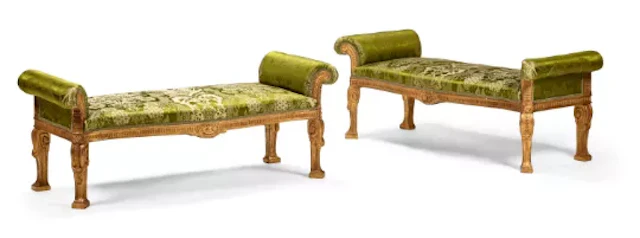 A PAIR OF CARVED GILTWOOD AND UPHOLSTERED WINDOW SEATS, IN THE MANNER