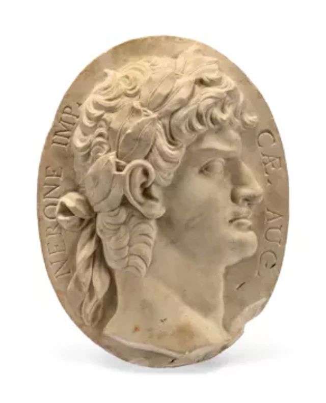 AFTER THE ANTIQUE, A MARBLE OVAL RELIEF BUST PORTRAIT OF NERO, PROBABLY