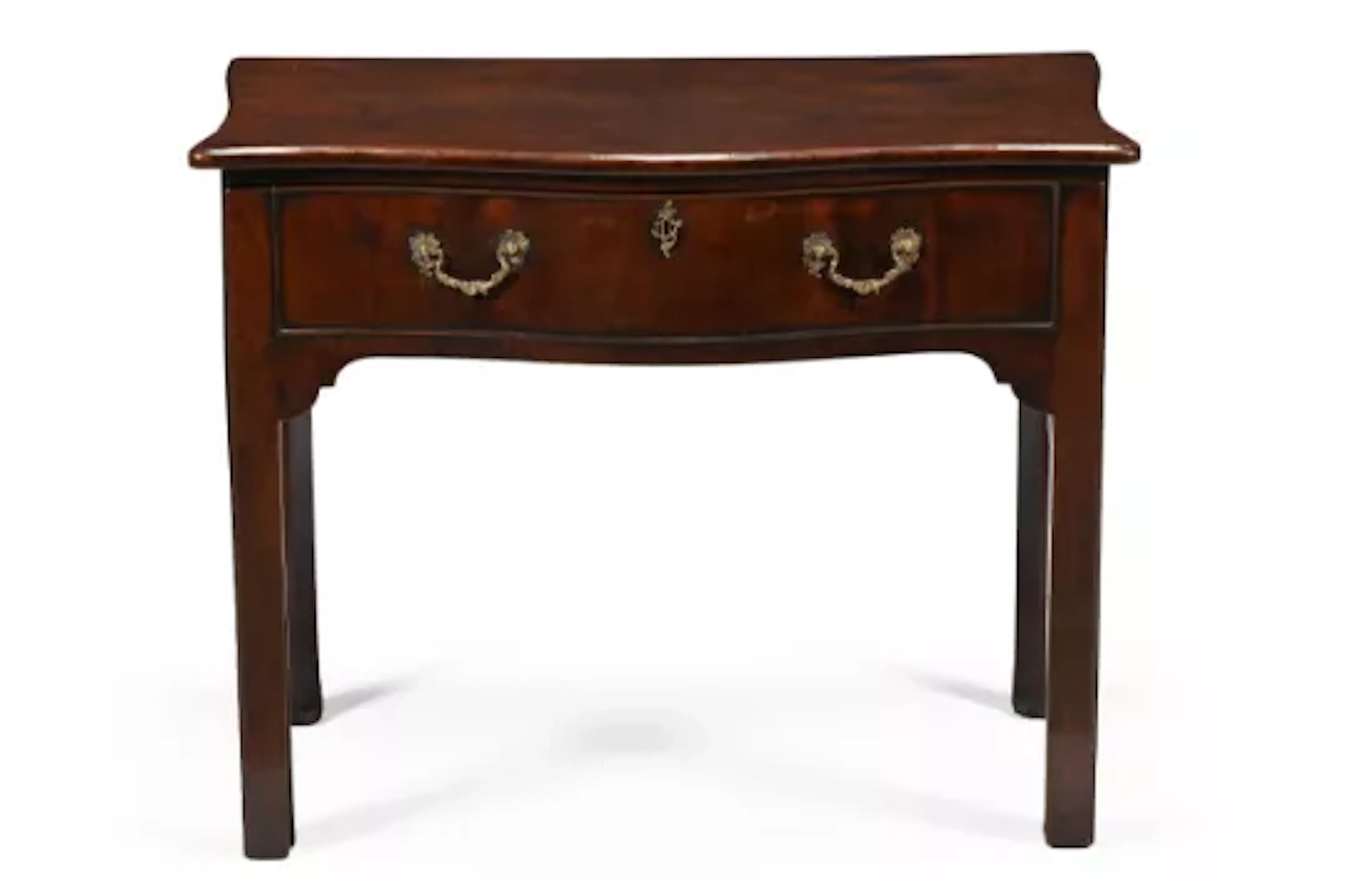 A GEORGE III MAHOGANY SERPENTINE FRONTED WRITING OR SIDE TABLE, CIRCA 1760