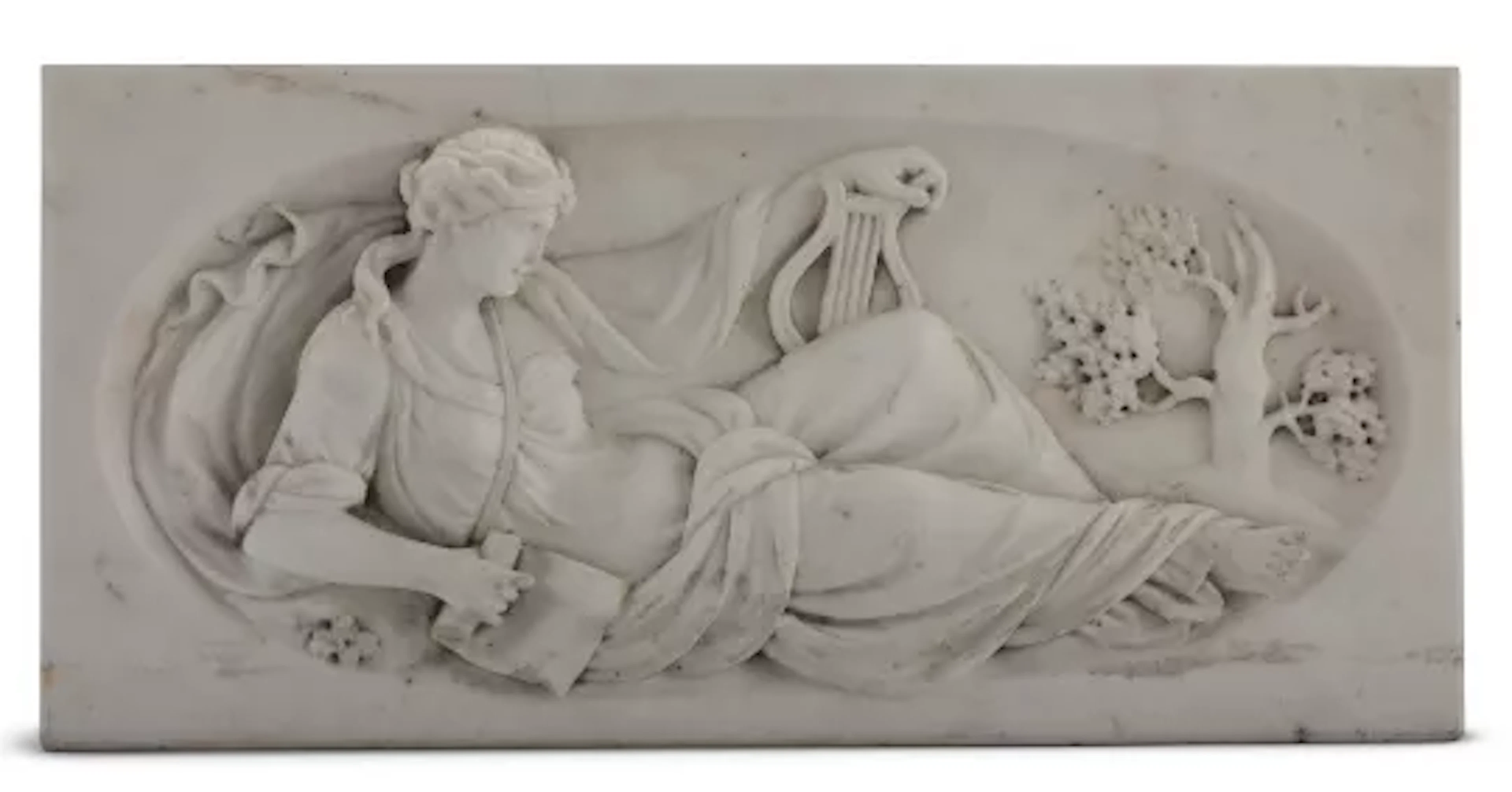 A CARVED MARBLE CHIMNEYPIECE TABLET OF THE MUSE OF MUSIC, 19TH CENTURY
