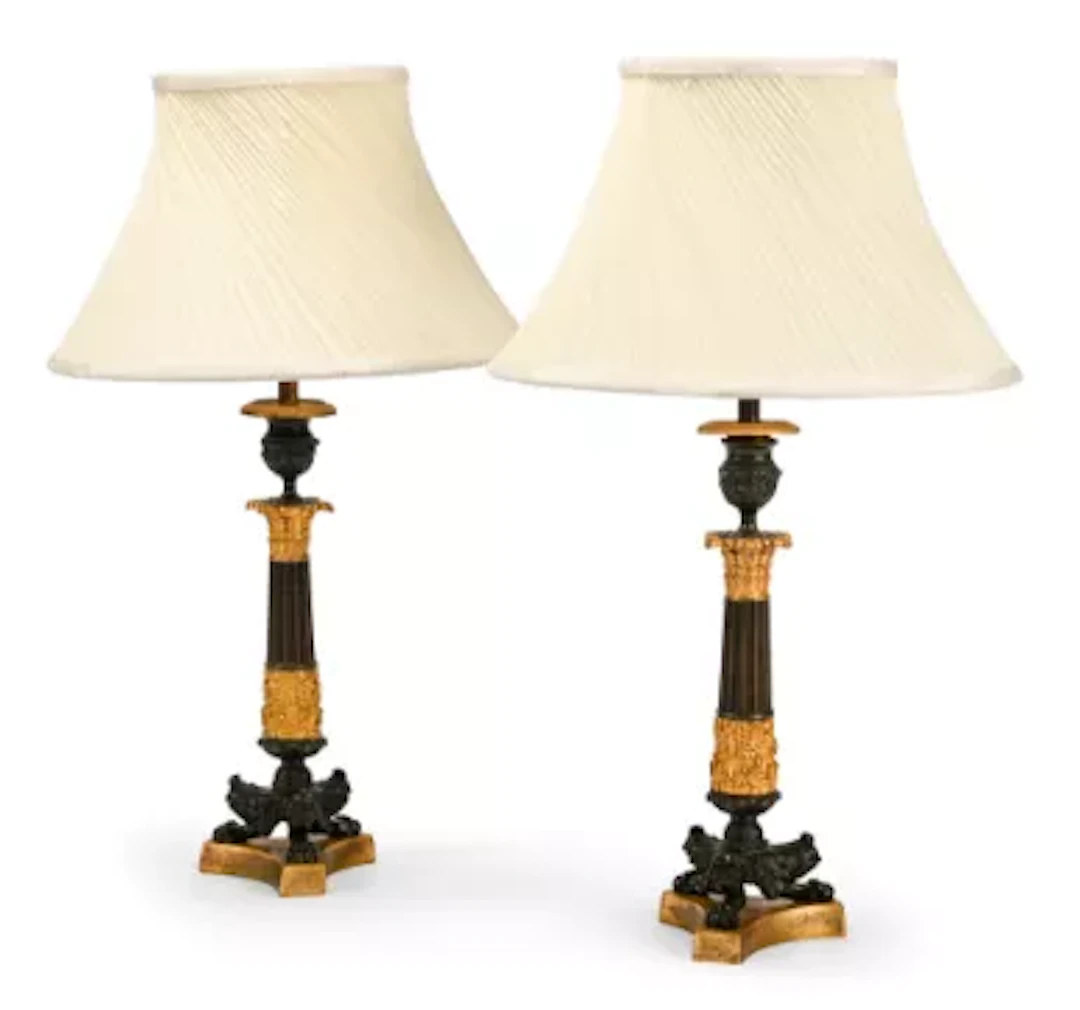 A PAIR OF GILT AND PATINATED HERCULANEUM BASE CANDLESTICK TABLE LIGHTS